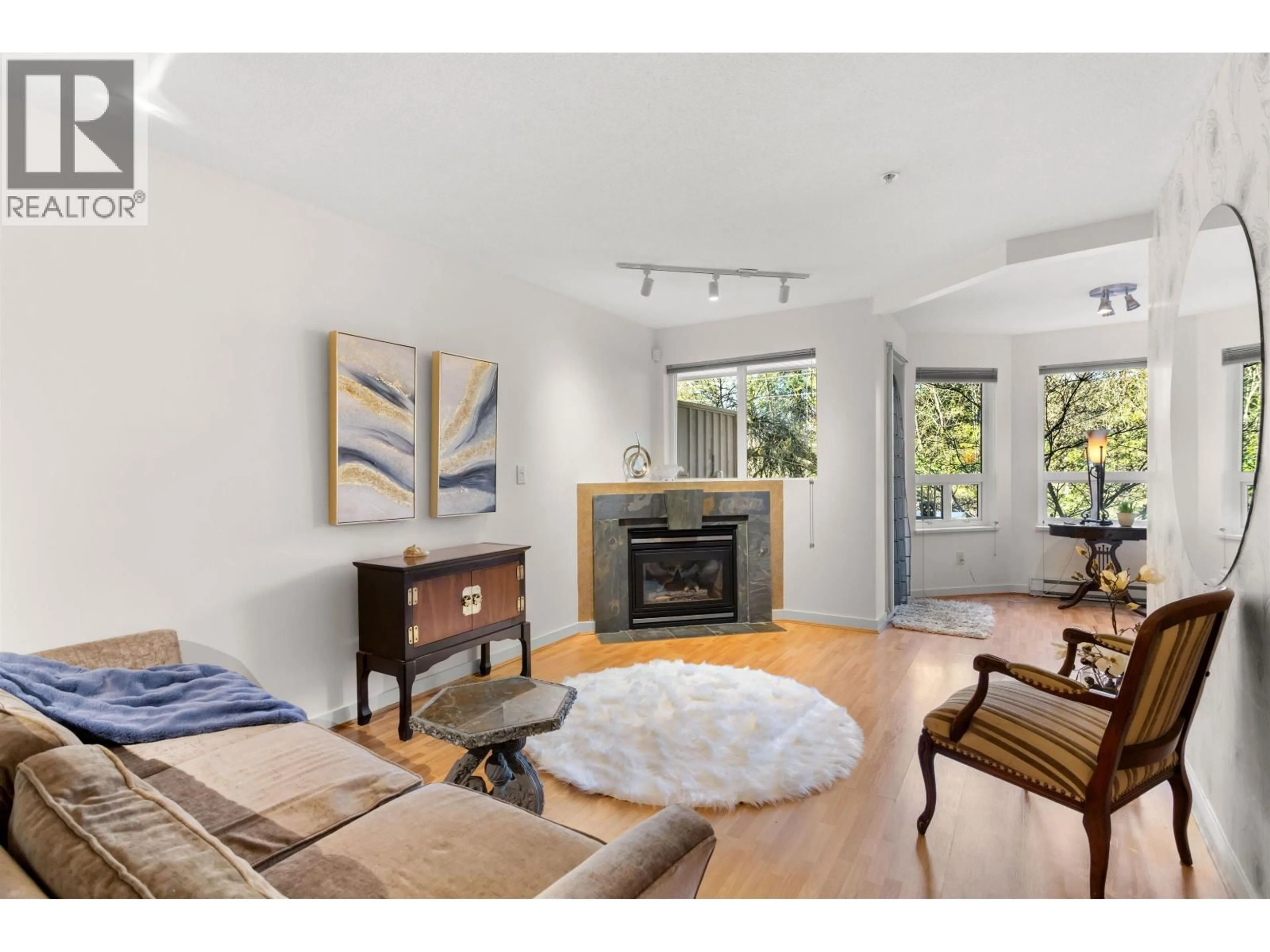 Living room with furniture, unknown for 210 - 7383 GRIFFITHS DRIVE, Burnaby British Columbia V5E4M8