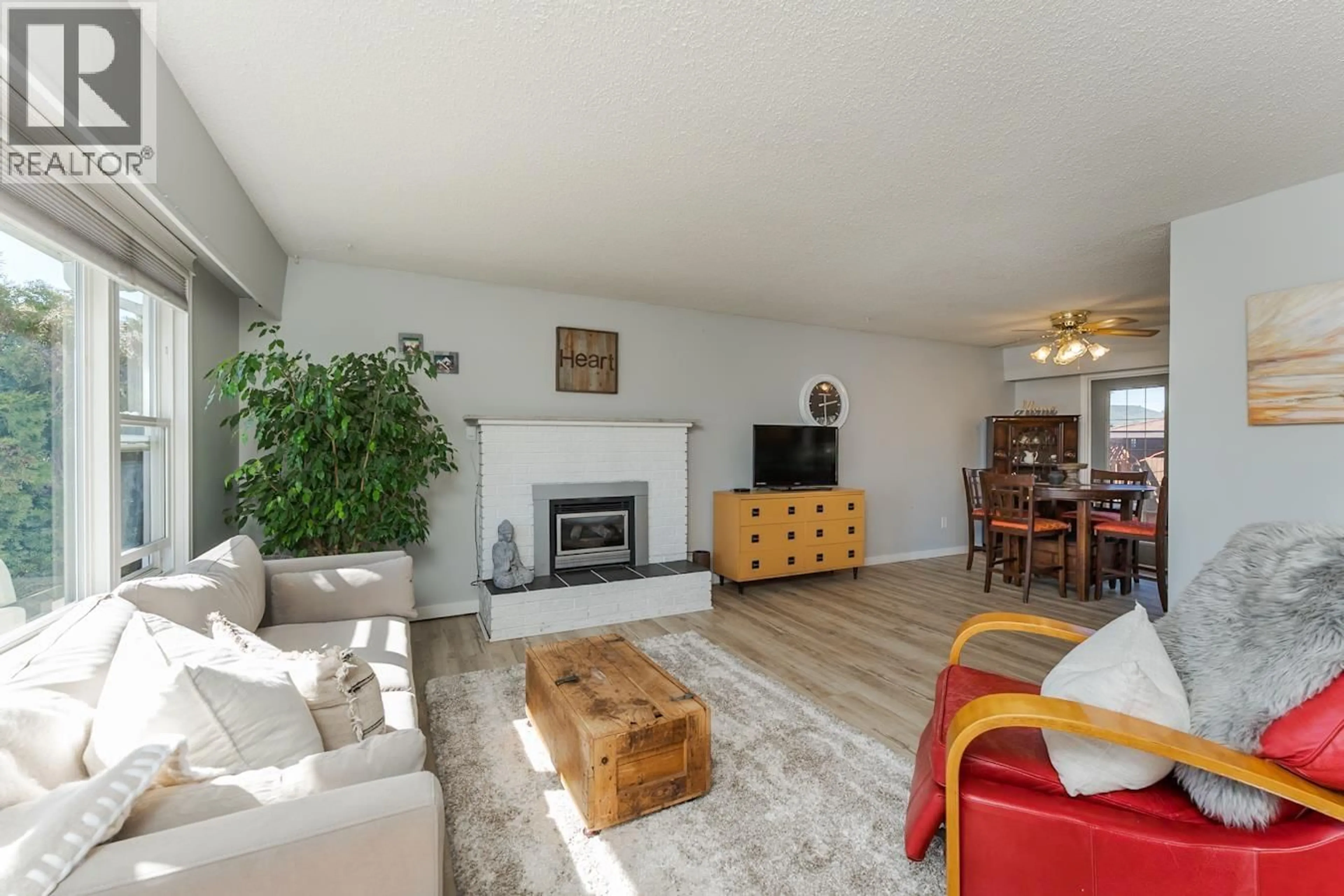 Living room with furniture, wood/laminate floor for 4234 TRAPPER AVENUE, Prince George British Columbia V2M5N1