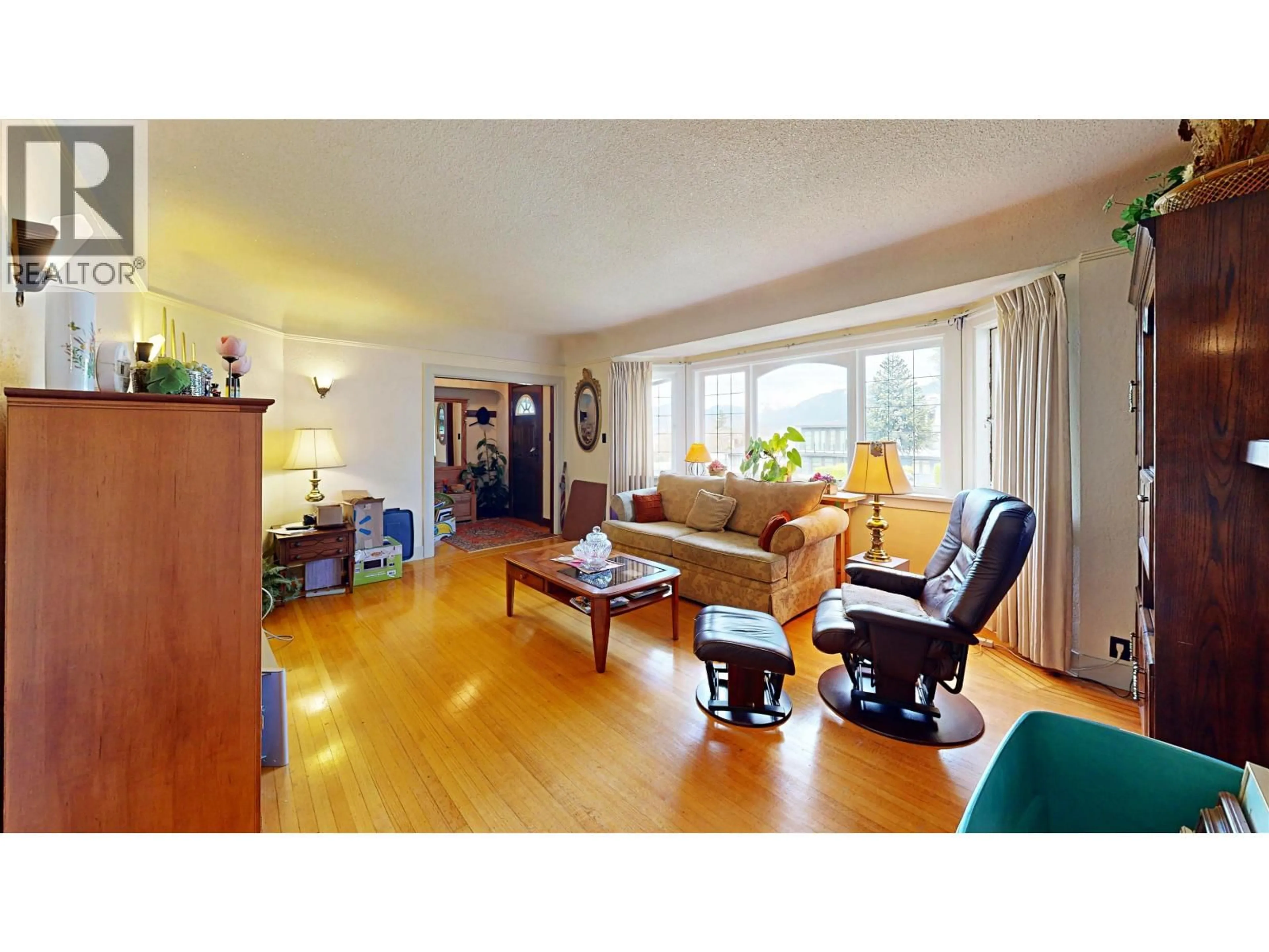 Living room with furniture, wood/laminate floor for 3624 CAMBRIDGE STREET, Vancouver British Columbia V5K1M6