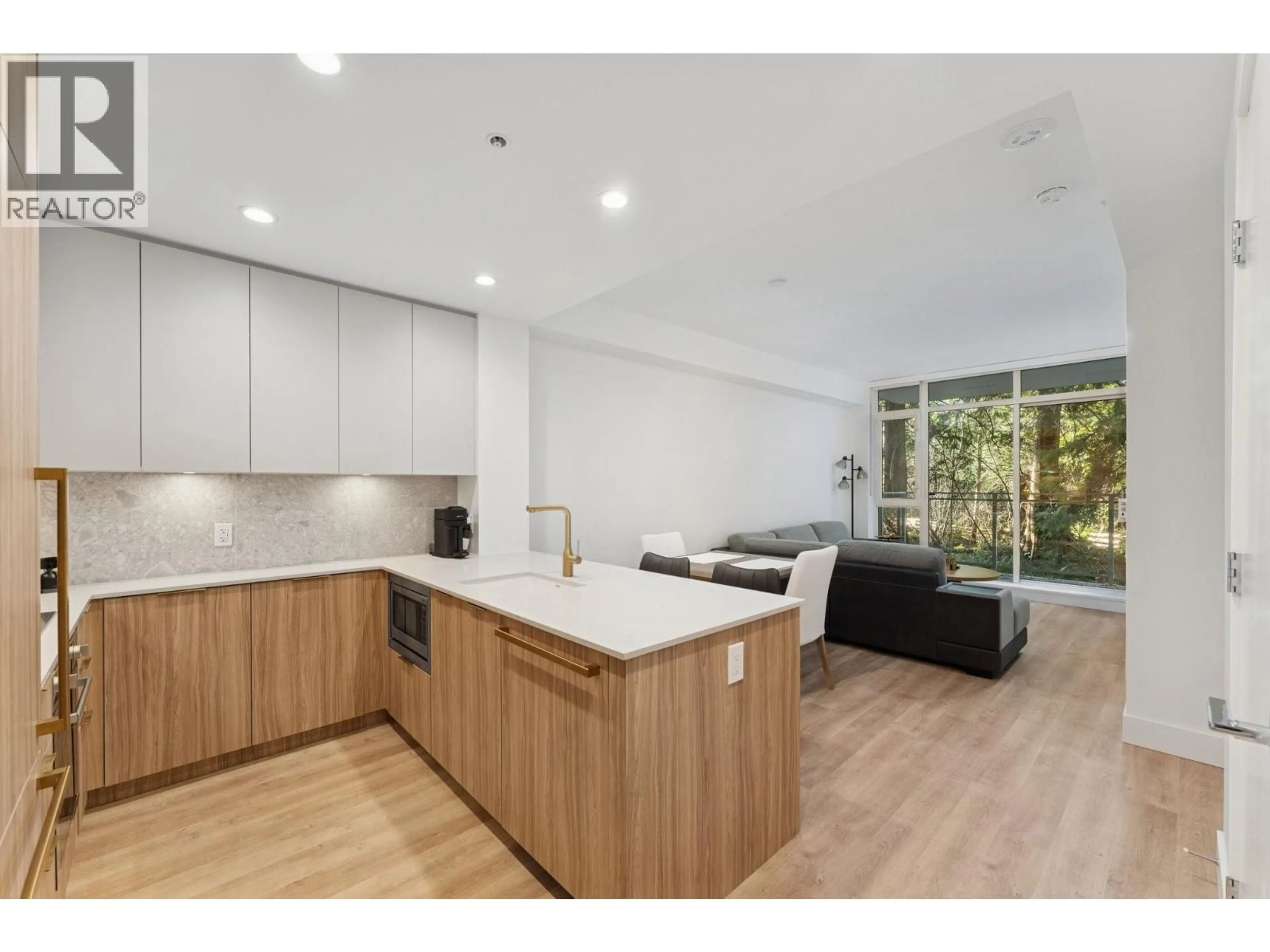 Open concept kitchen, wood/laminate floor for 208 - 2375 EMERY COURT, North Vancouver British Columbia V7J0E8