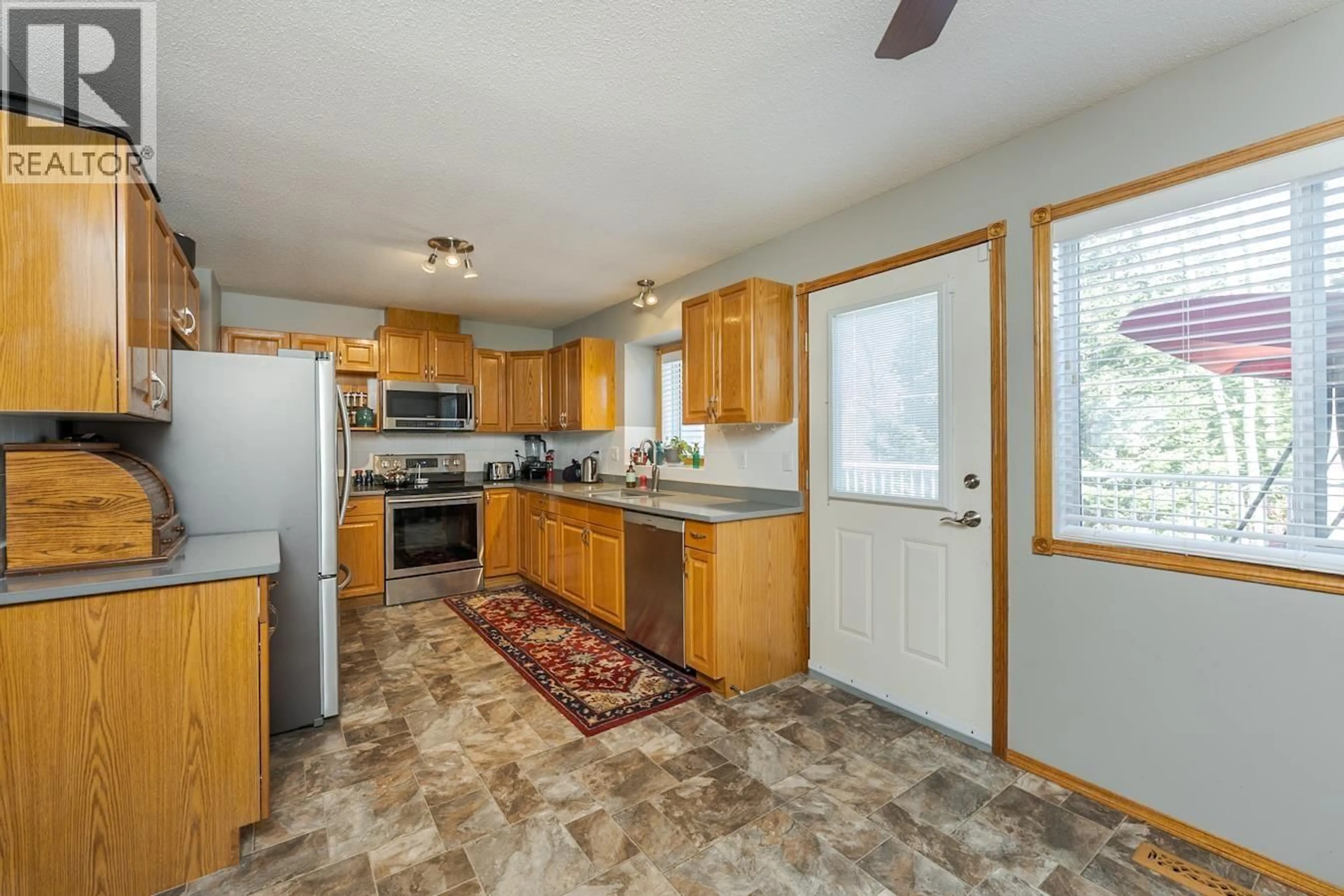 Open concept kitchen, ceramic/tile floor for 104 - 6450 DAWSON ROAD, Prince George British Columbia V2K5Y4