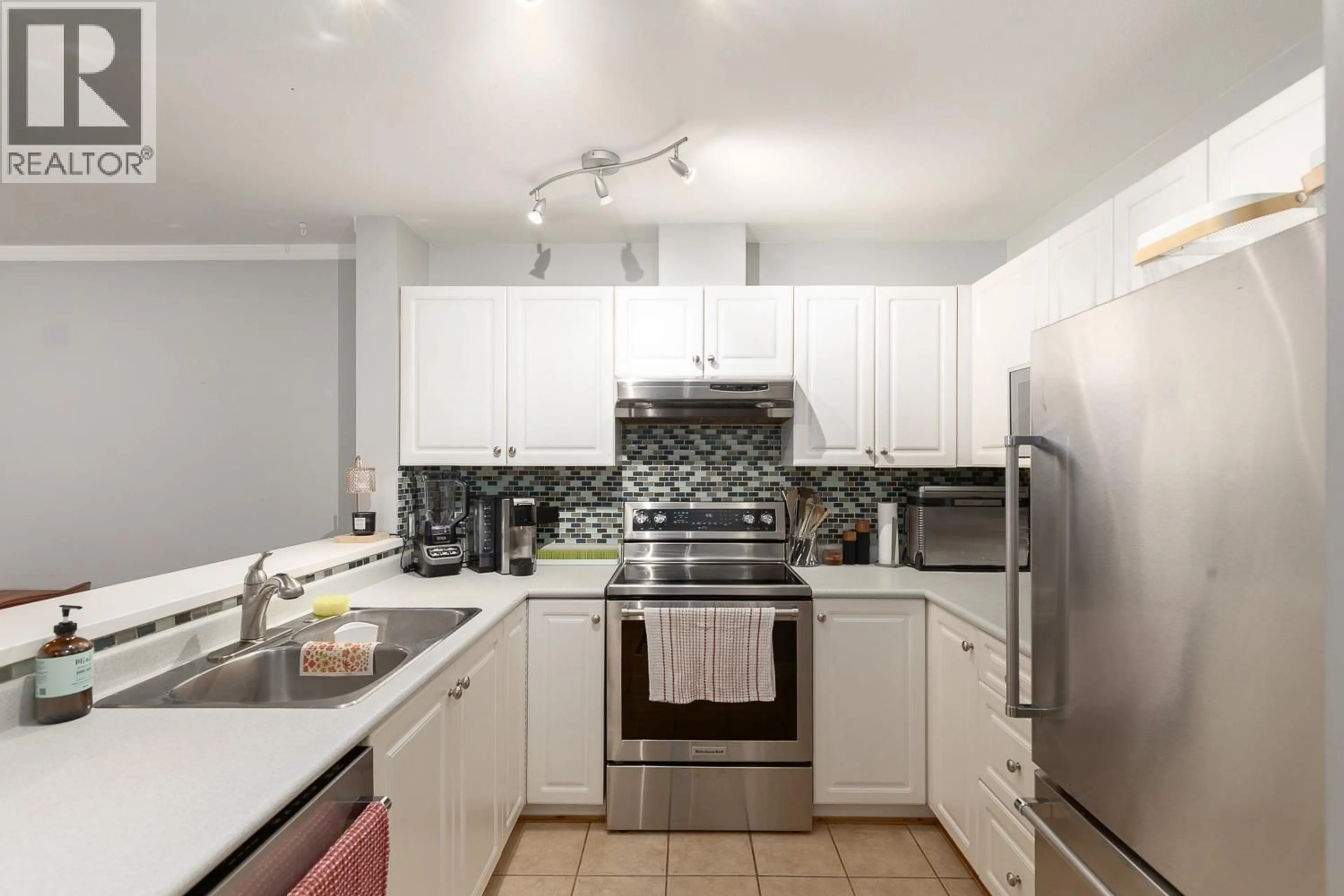 Standard kitchen, ceramic/tile floor for 107 - 3038 KENT AVENUE SOUTH, Vancouver British Columbia V5S4V8