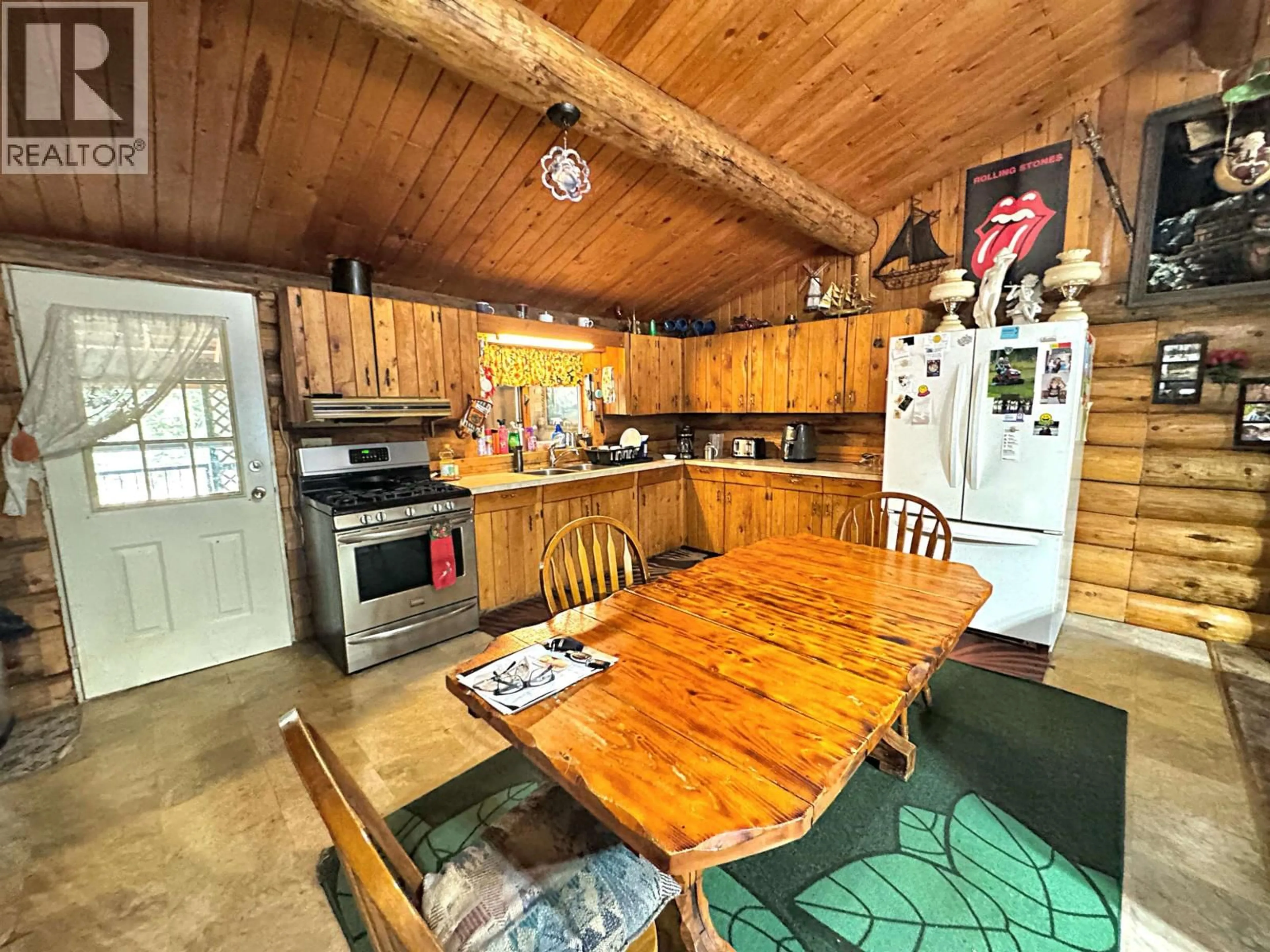 Rustic kitchen, wood/laminate floor for 6265 HORSE LAKE ROAD, Horse Lake British Columbia V0K2E3