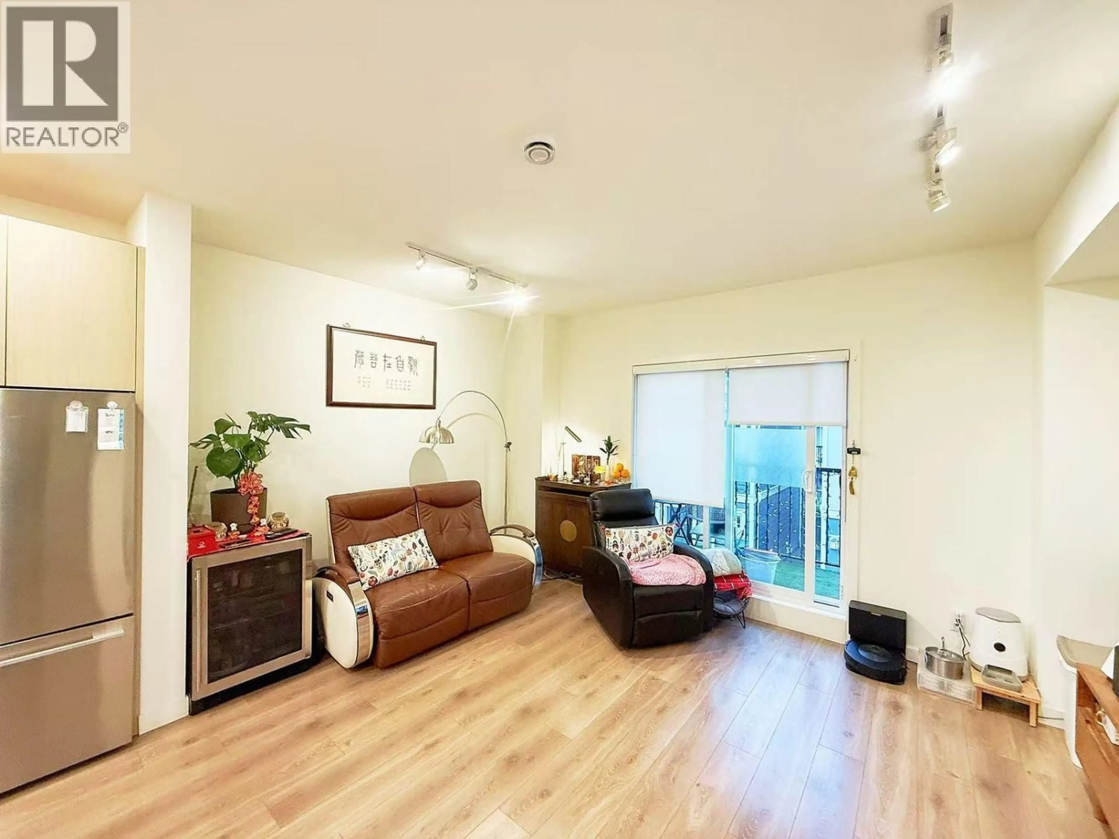 Living room with furniture, wood/laminate floor for 8 - 7780 BRIDGE STREET, Richmond British Columbia V6Y0L2