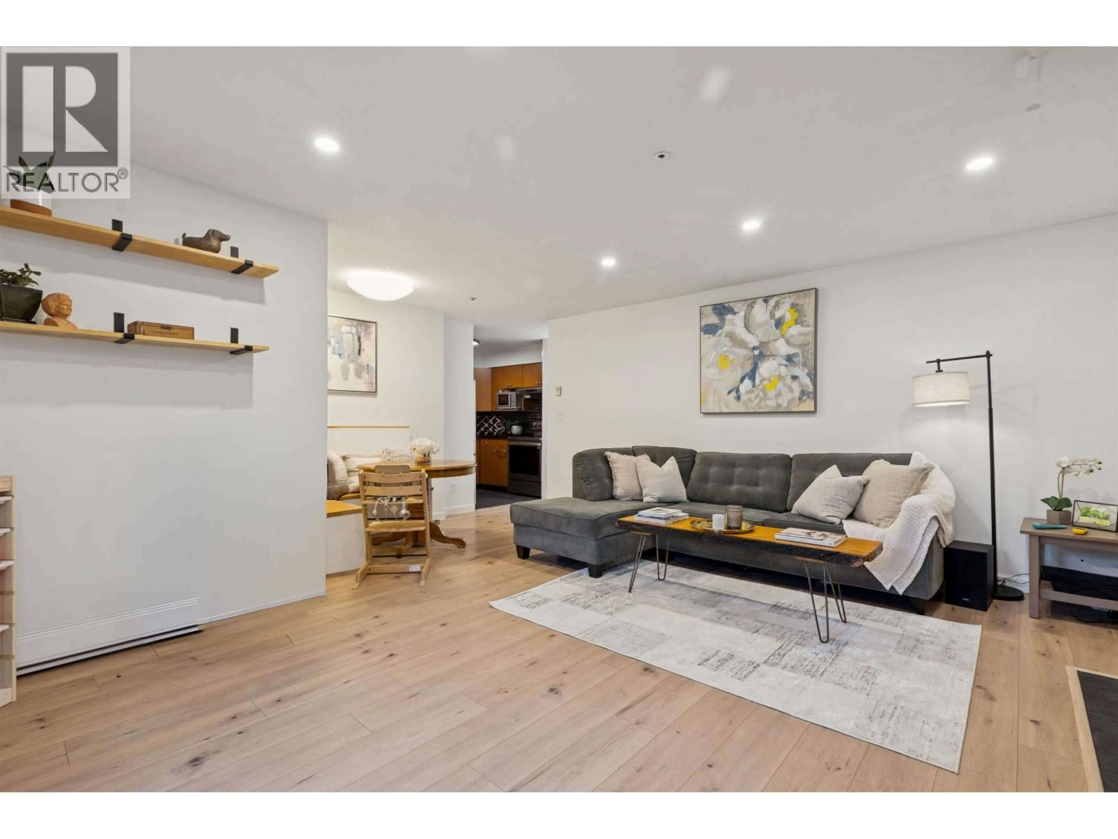 Living room with furniture, wood/laminate floor for 102 - 1689 4TH AVENUE, Vancouver British Columbia V5N1J7