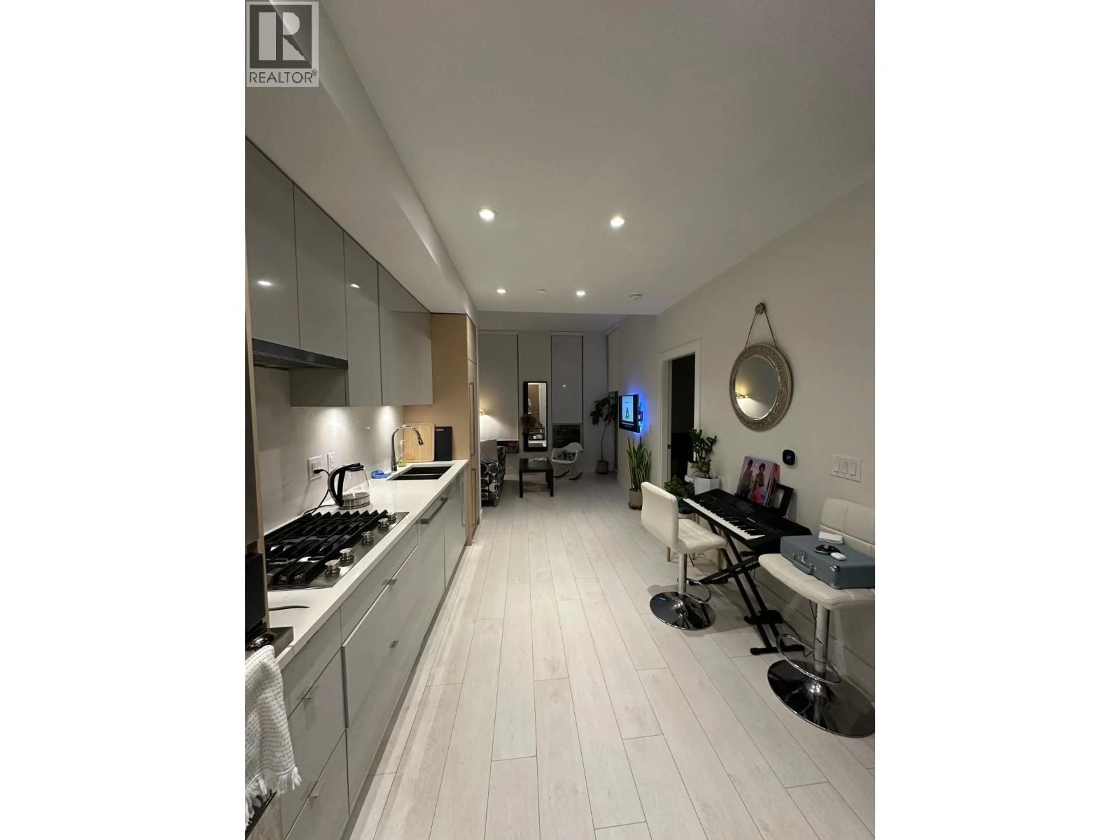 Open concept kitchen, ceramic/tile floor for 426 - 3438 SAWMILL CRESCENT, Vancouver British Columbia V5S0E3