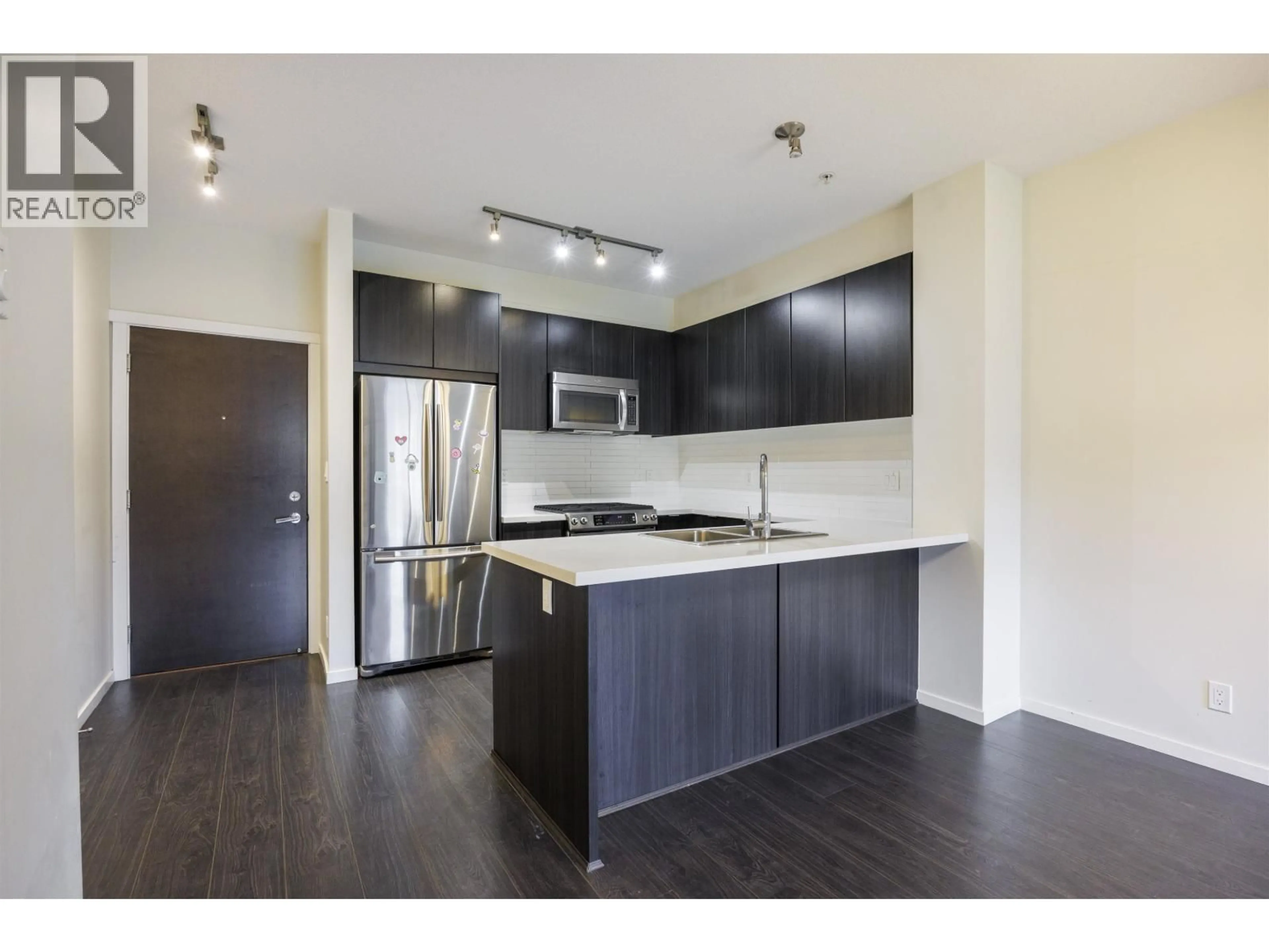 Open concept kitchen, wood/laminate floor for 213 - 3107 WINDSOR GATE, Coquitlam British Columbia V3B0L1