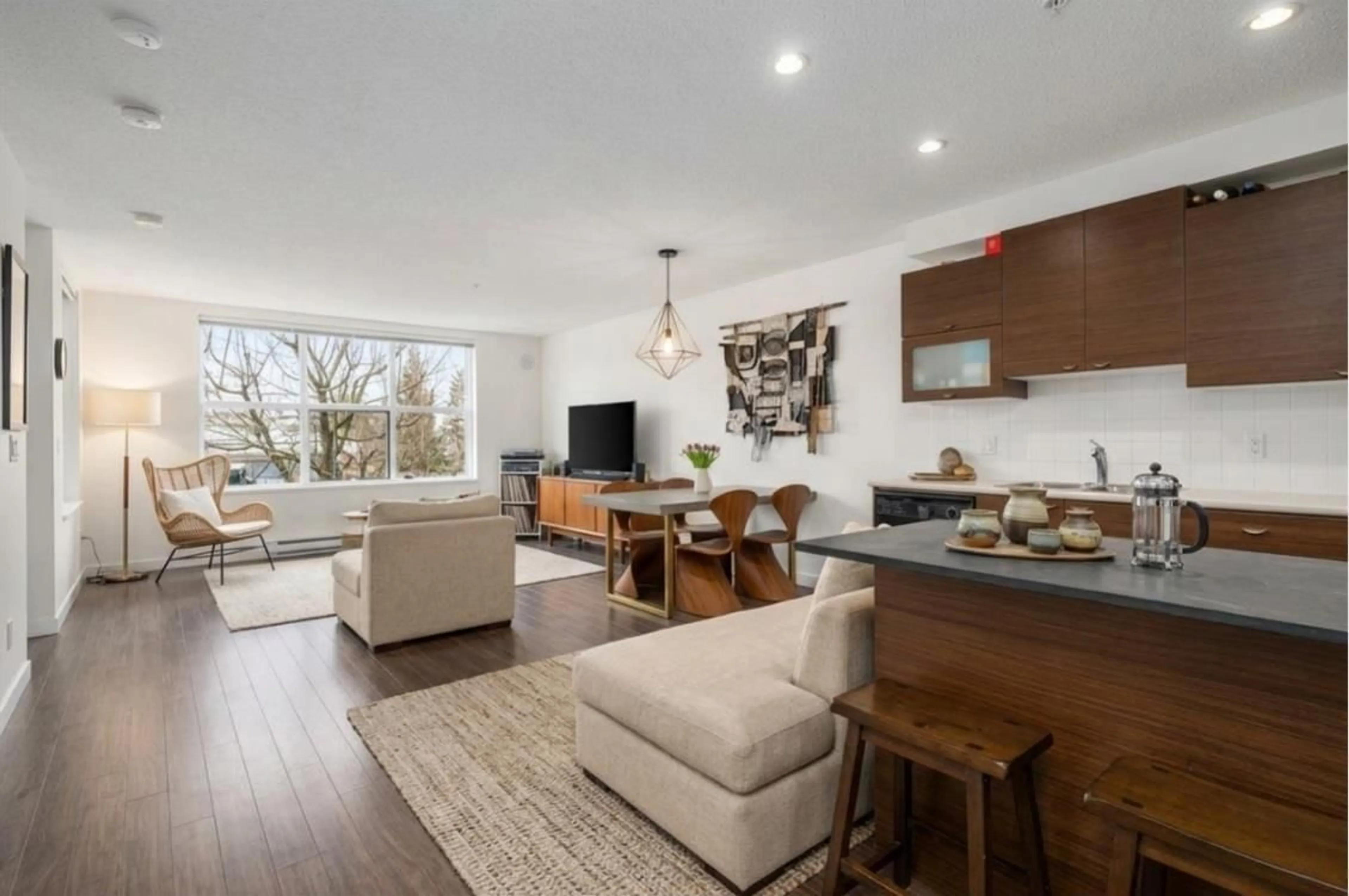 Open concept kitchen, wood/laminate floor for 205 - 10707 139 STREET, Surrey British Columbia V3T0B2