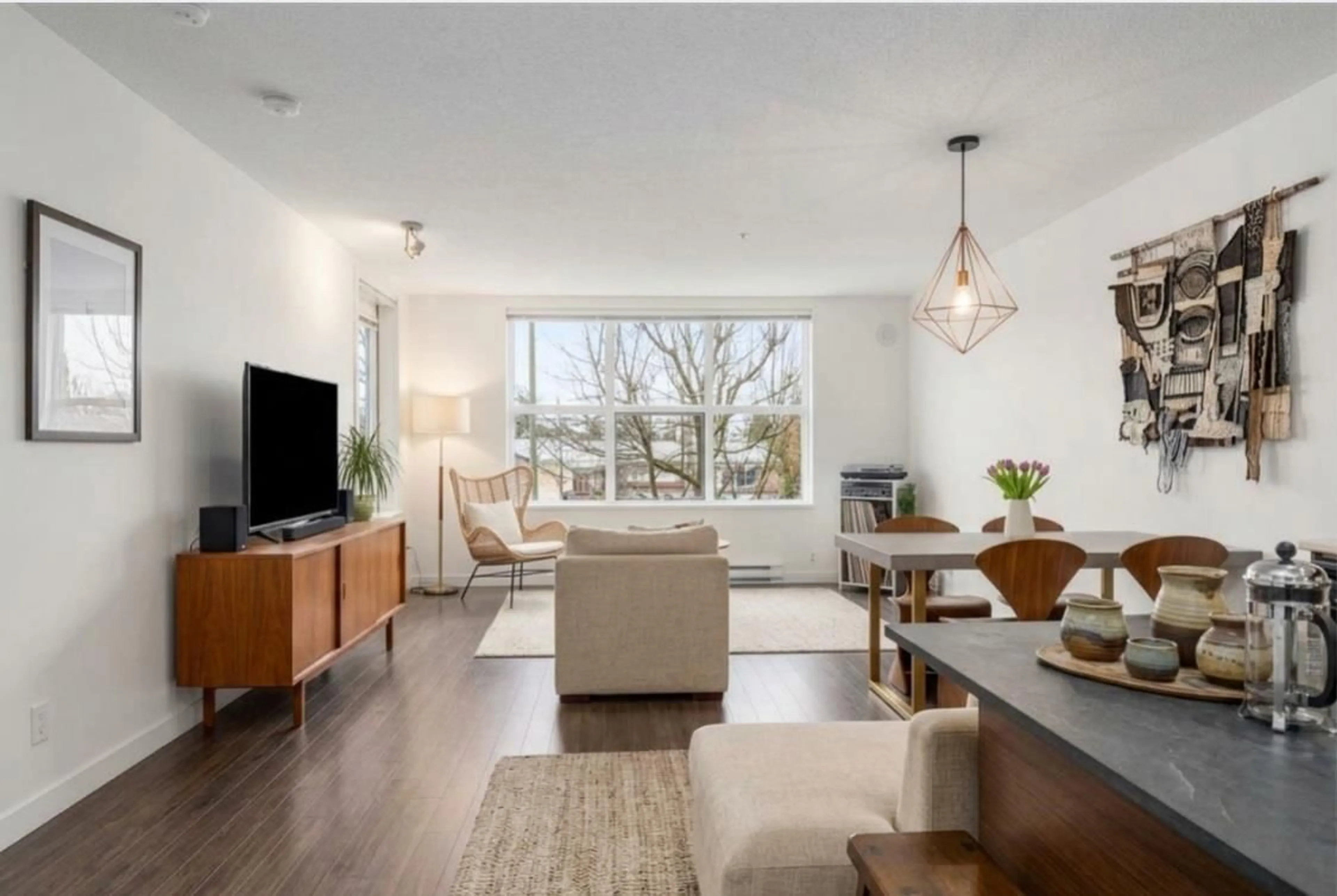 Living room with furniture, wood/laminate floor for 205 - 10707 139 STREET, Surrey British Columbia V3T0B2