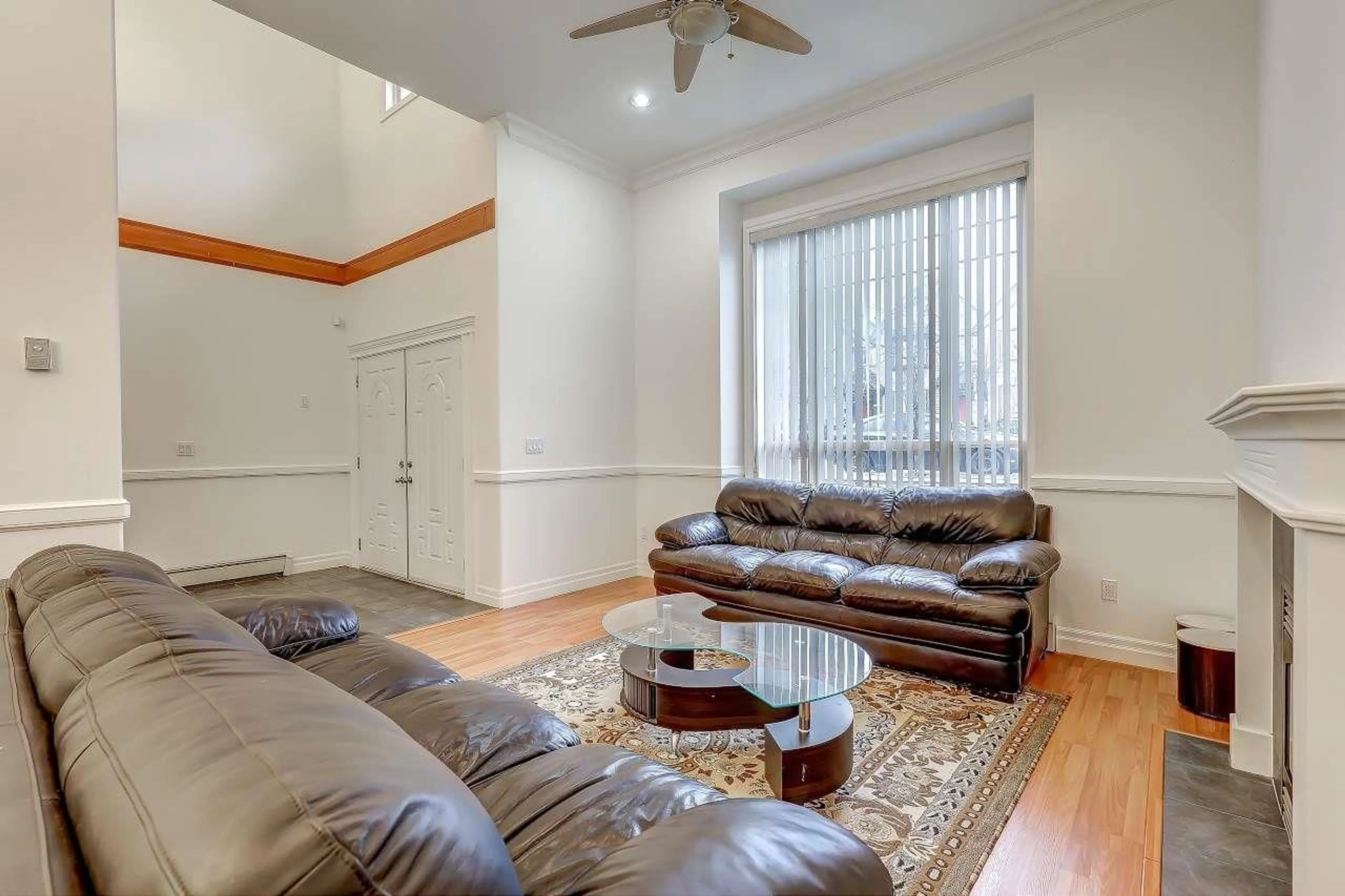 Living room with furniture, wood/laminate floor for 14578 68 AVENUE, Surrey British Columbia V3S2A9