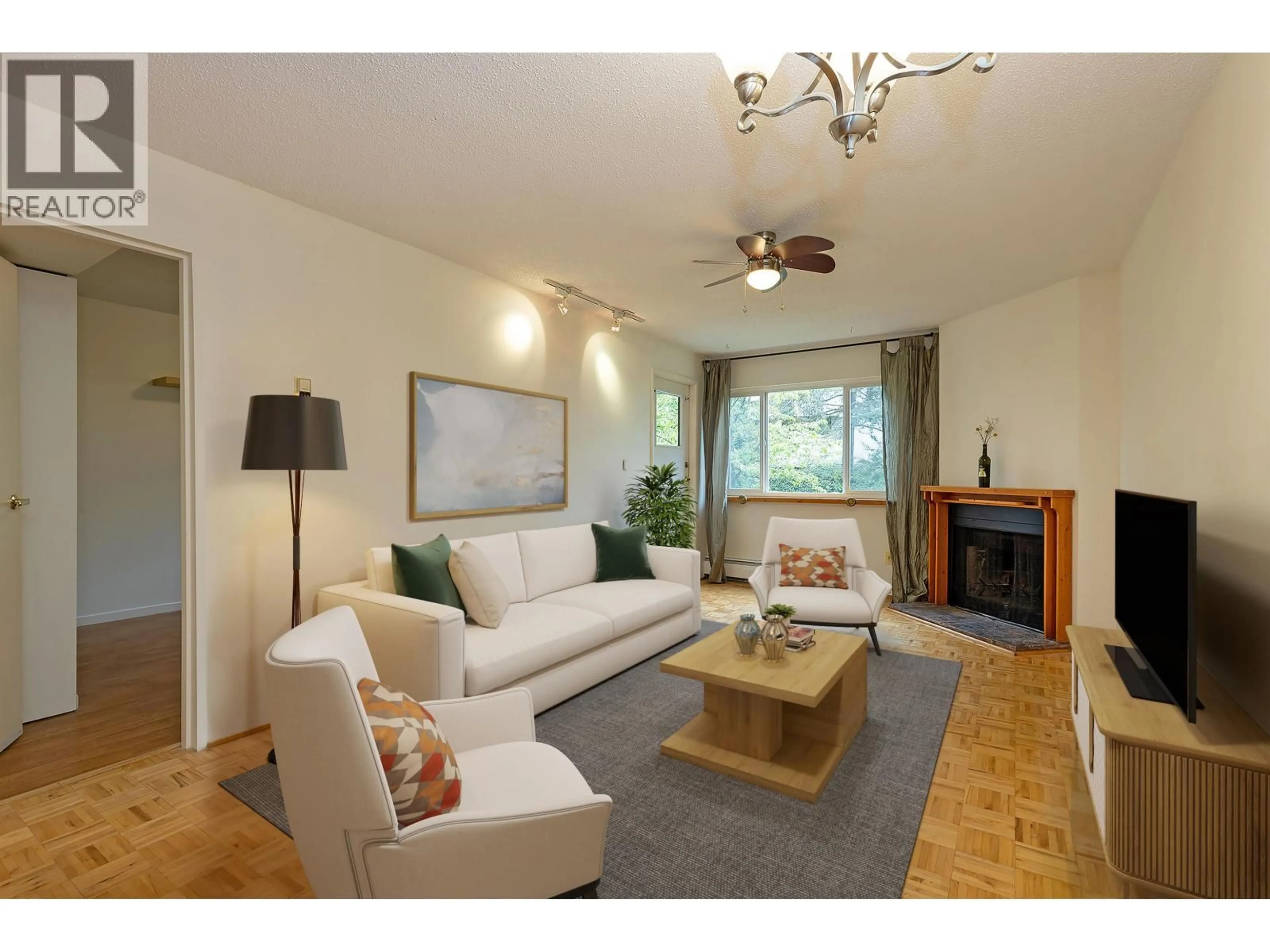 Living room with furniture, wood/laminate floor for 213 - 1209 HOWIE AVENUE, Coquitlam British Columbia V3J1T9