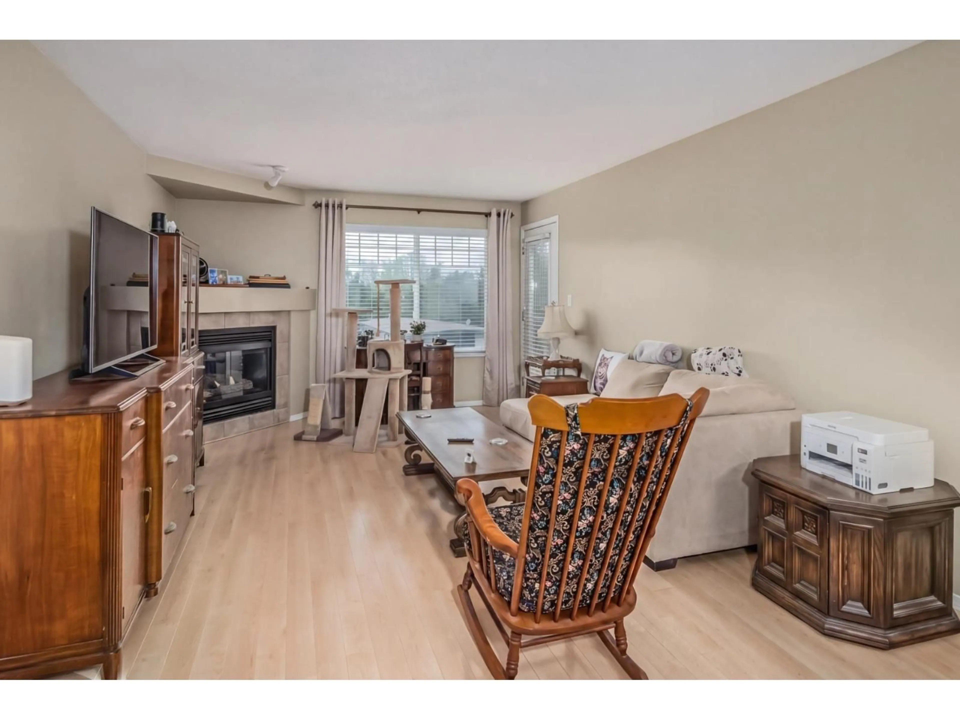 Living room with furniture, wood/laminate floor for 301 - 2350 WESTERLY STREET, Abbotsford British Columbia V2T6T7