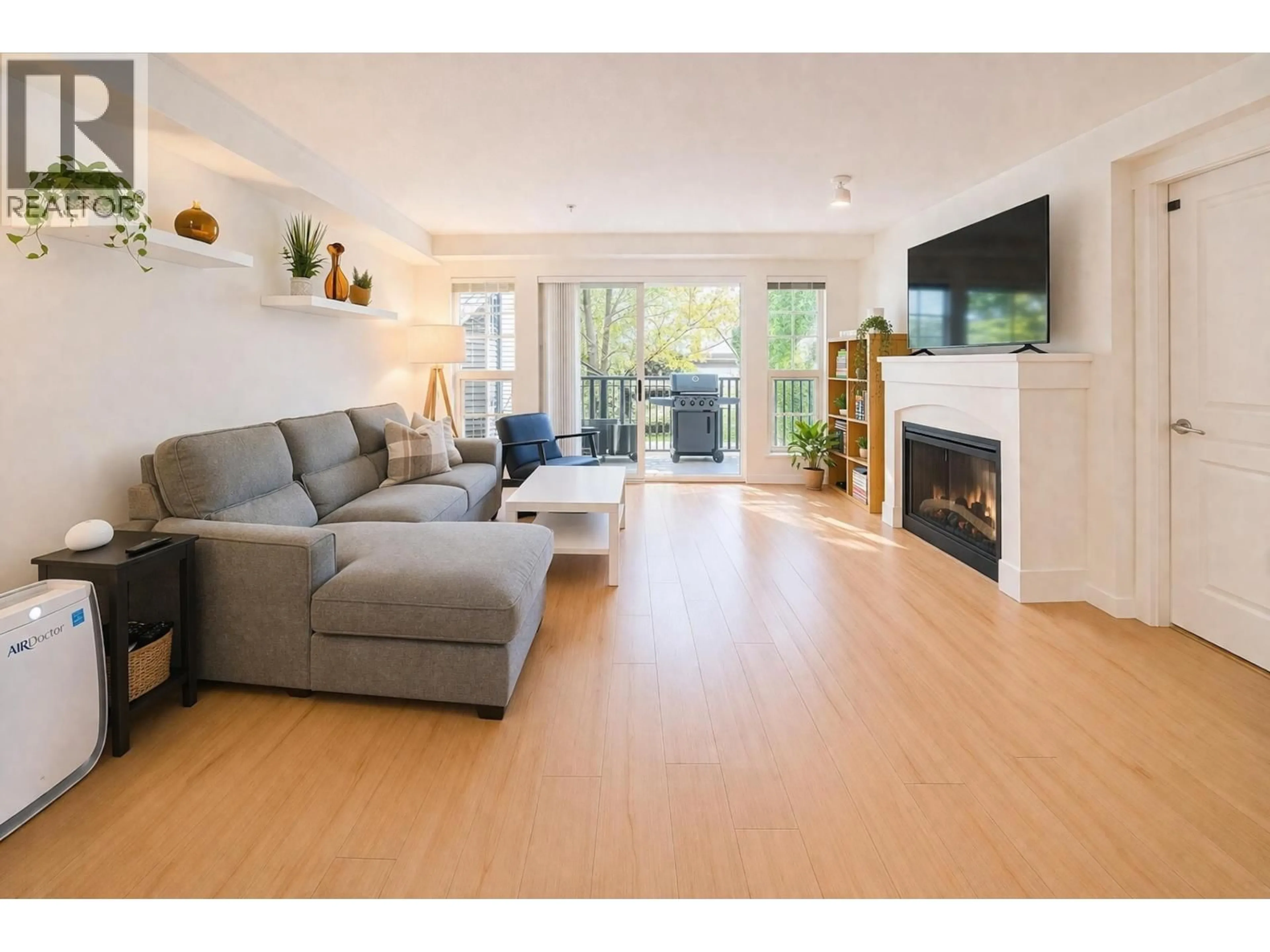 Living room with furniture, wood/laminate floor for 208 - 2958 SILVER SPRINGS BOULEVARD, Coquitlam British Columbia V3E3R9