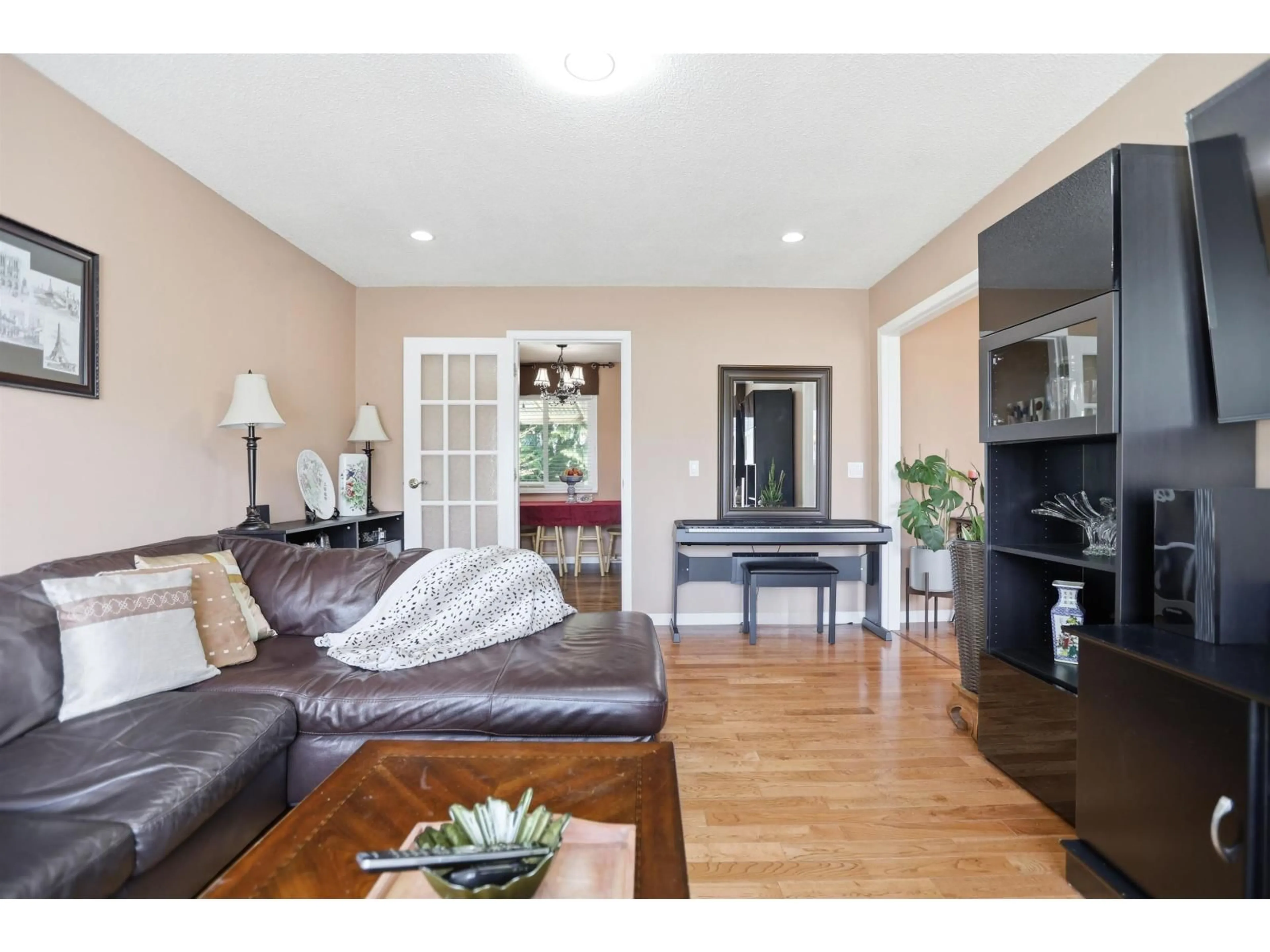 Living room with furniture, wood/laminate floor for 11415 72A AVENUE, Delta British Columbia V4C1A7