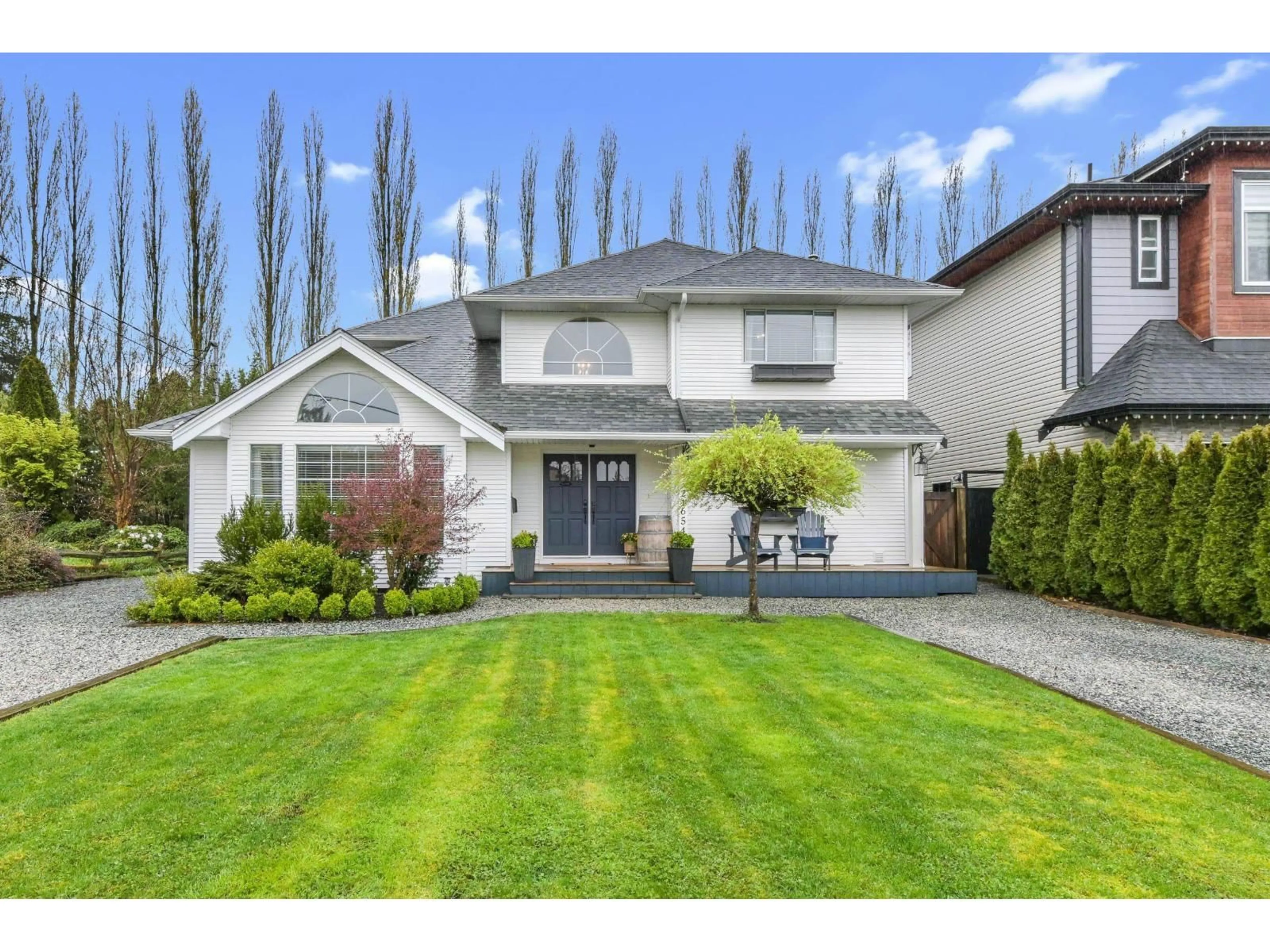 Home with vinyl exterior material, street for 21654 49A AVENUE, Langley British Columbia V3A5Z3