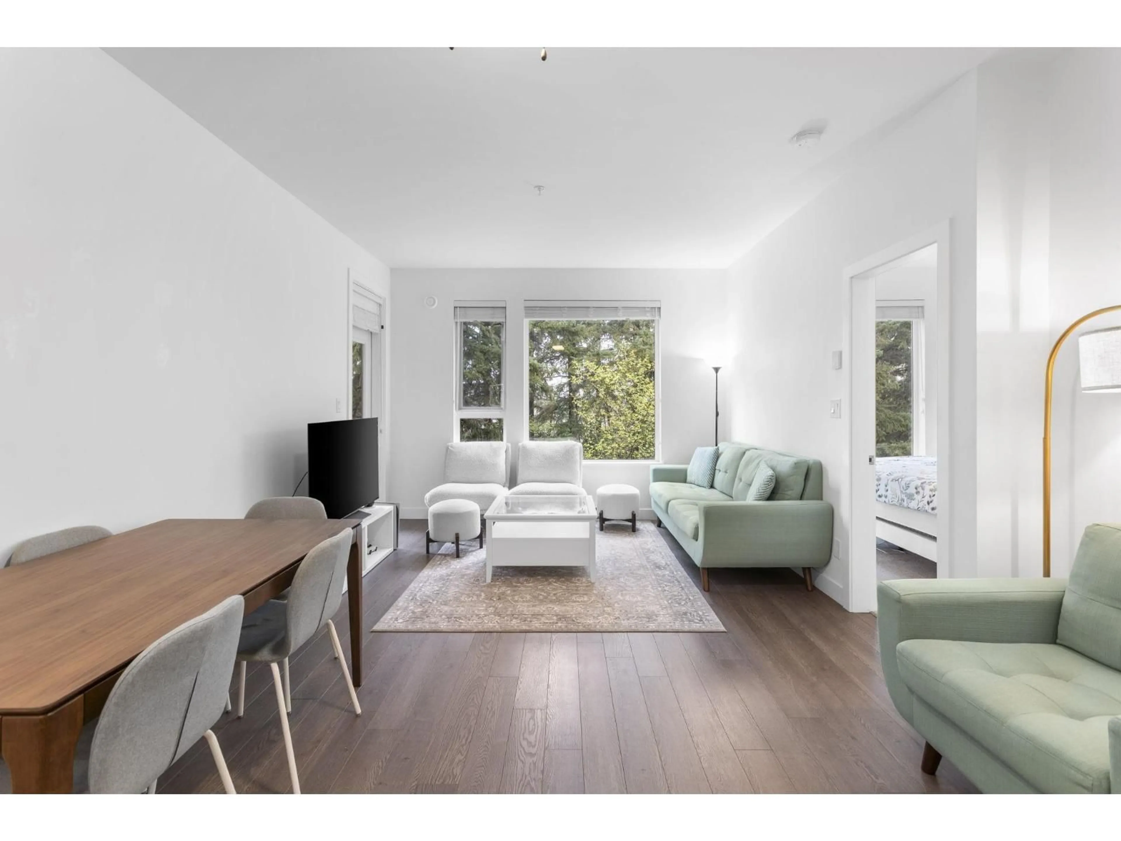 Living room with furniture, wood/laminate floor for 304 - 8360 DELSOM WAY, Delta British Columbia V4C0E6