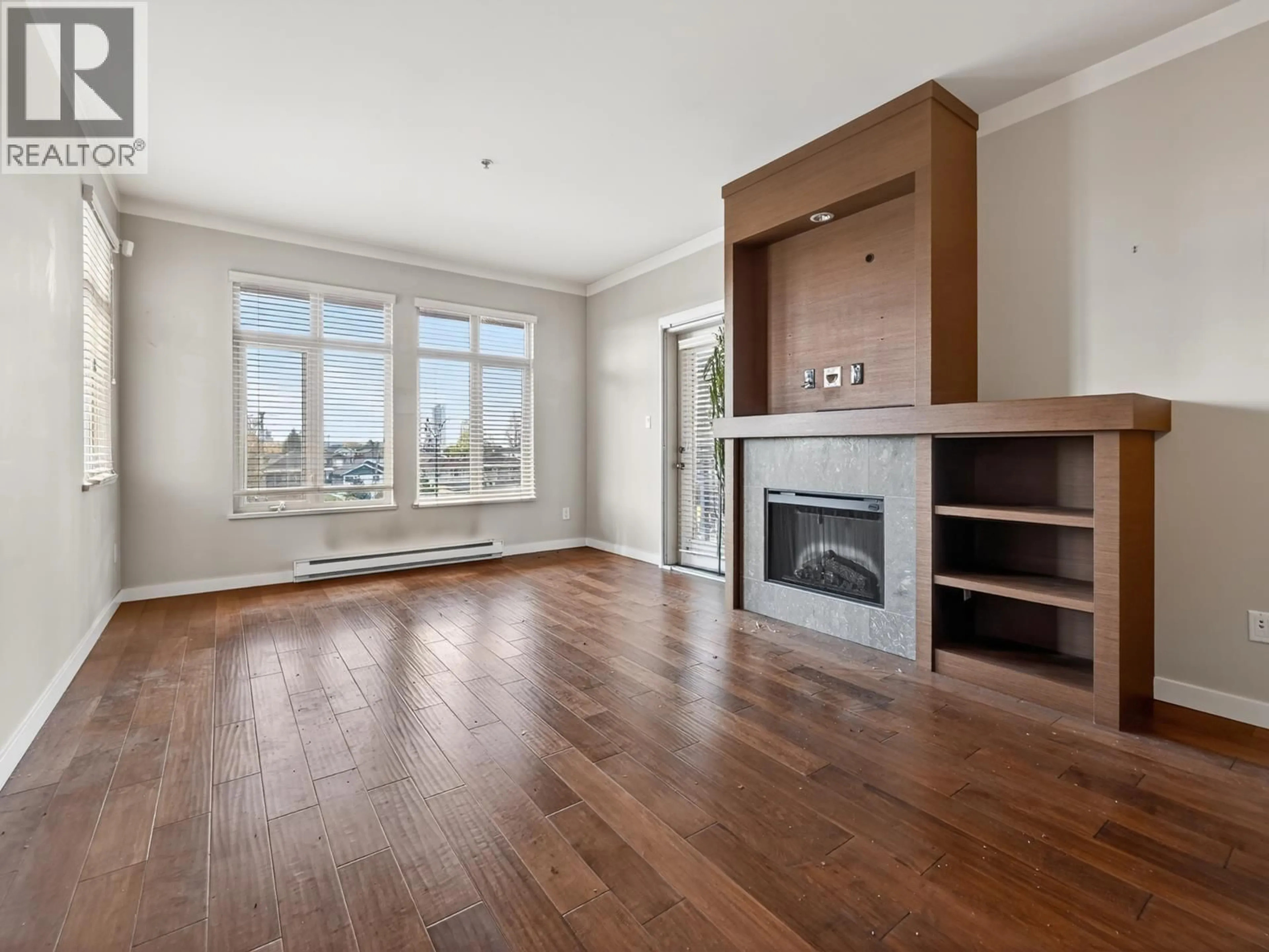 Living room with furniture, wood/laminate floor for 302 - 4365 HASTINGS STREET, Burnaby British Columbia V5C2J7