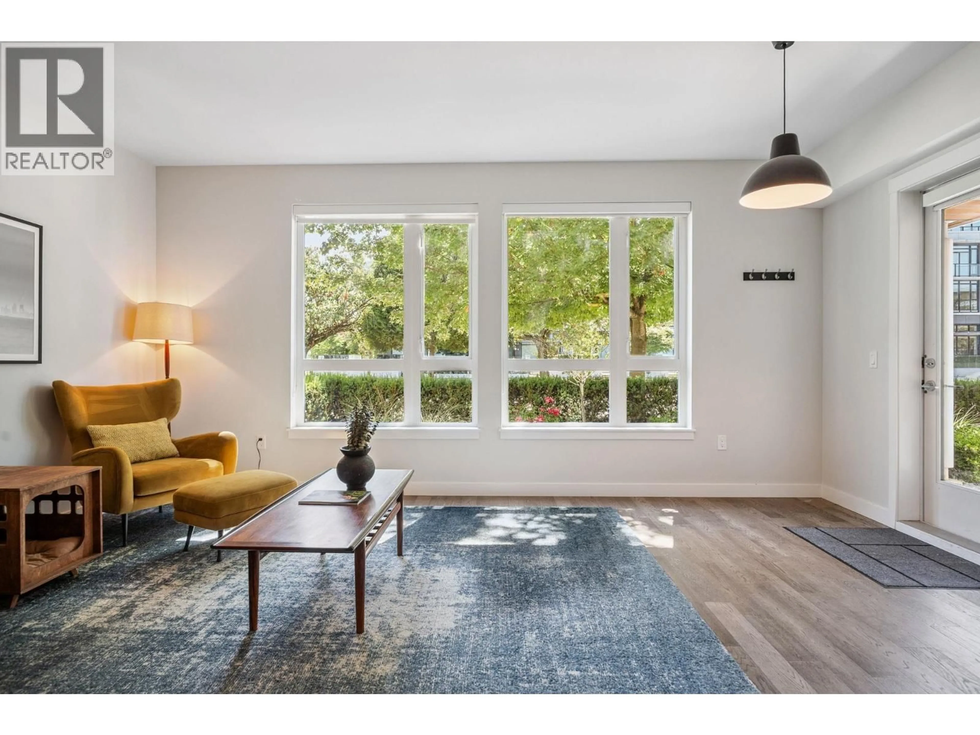 Living room with furniture, wood/laminate floor for 110 - 4080 YUKON STREET, Vancouver British Columbia V5Y0L4