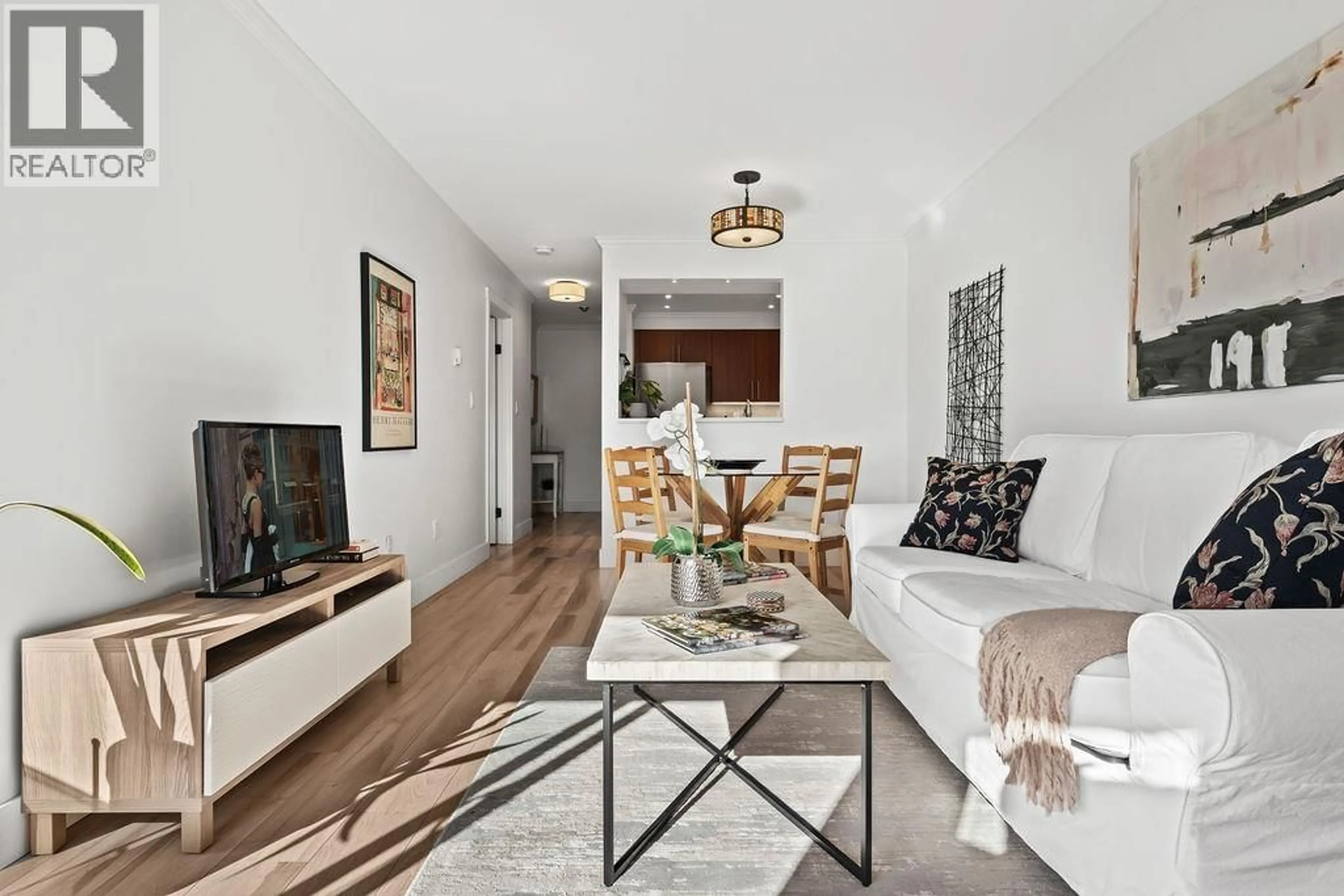 Living room with furniture, wood/laminate floor for 207 - 235 4TH STREET, North Vancouver British Columbia V7M1H8