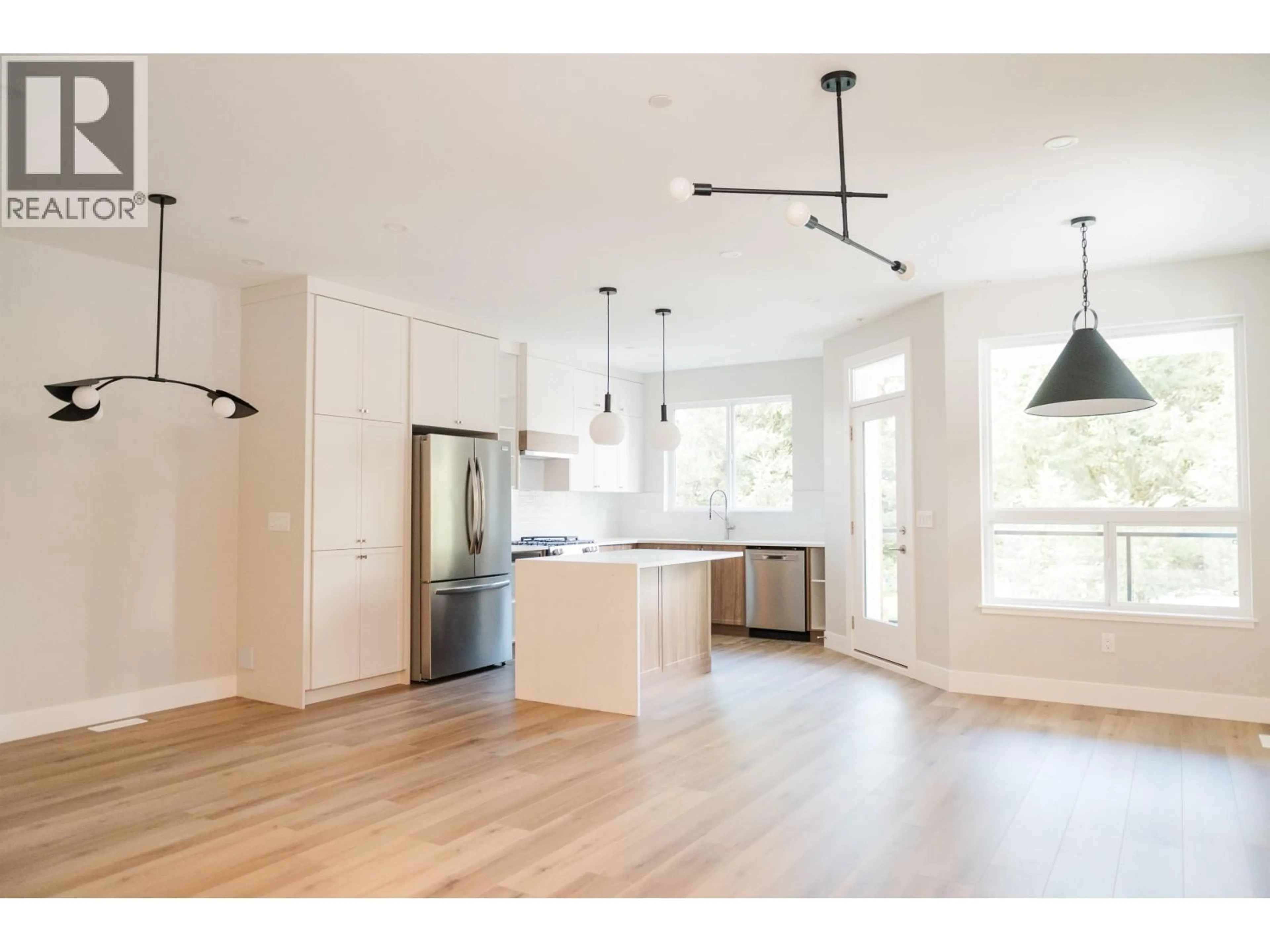 Open concept kitchen, wood/laminate floor for A - 21425 121 AVENUE, Maple Ridge British Columbia V2X3S5