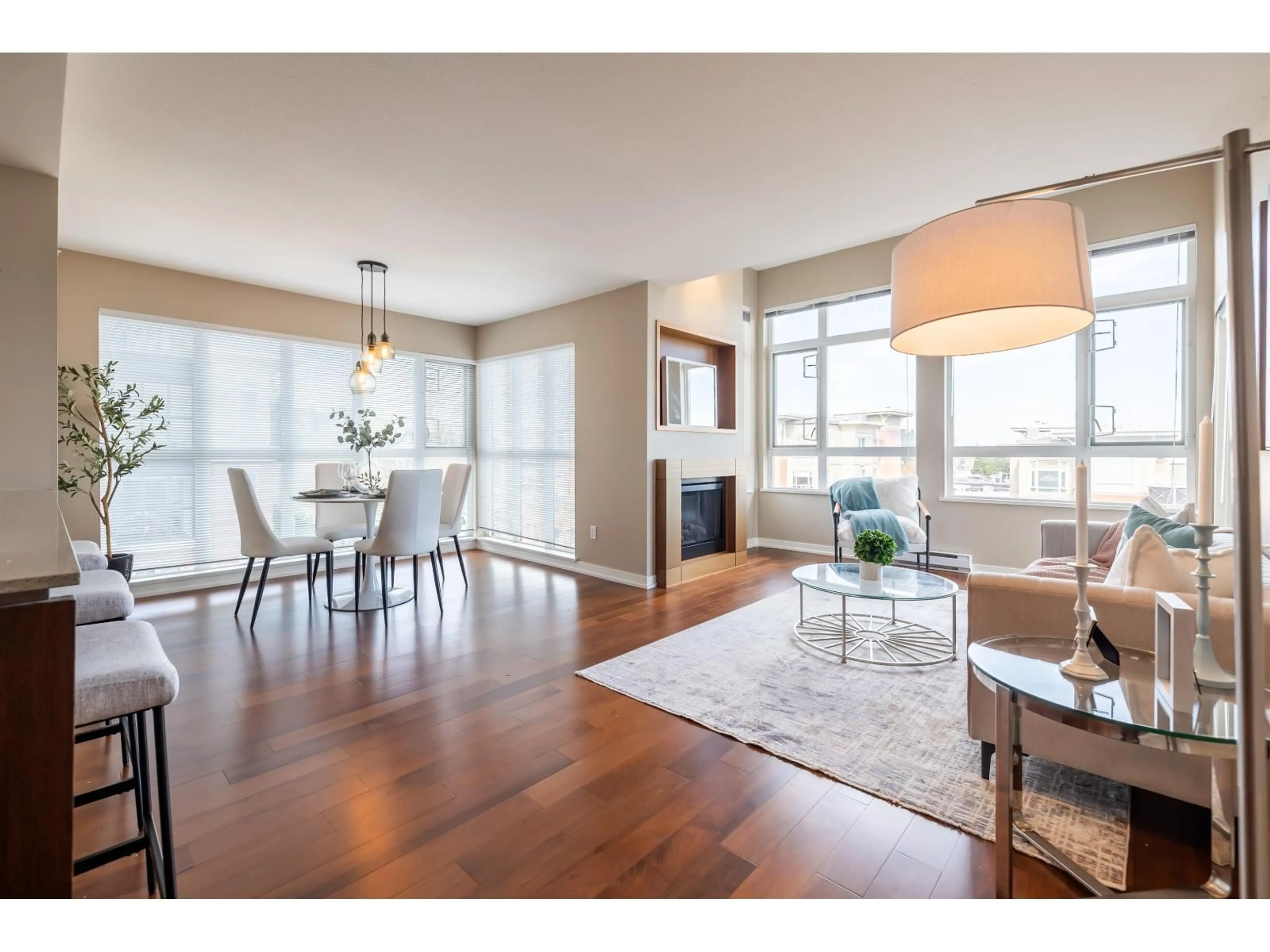 Living room with furniture, wood/laminate floor for 402 - 2950 KING GEORGE BOULEVARD, Surrey British Columbia V4P0E5