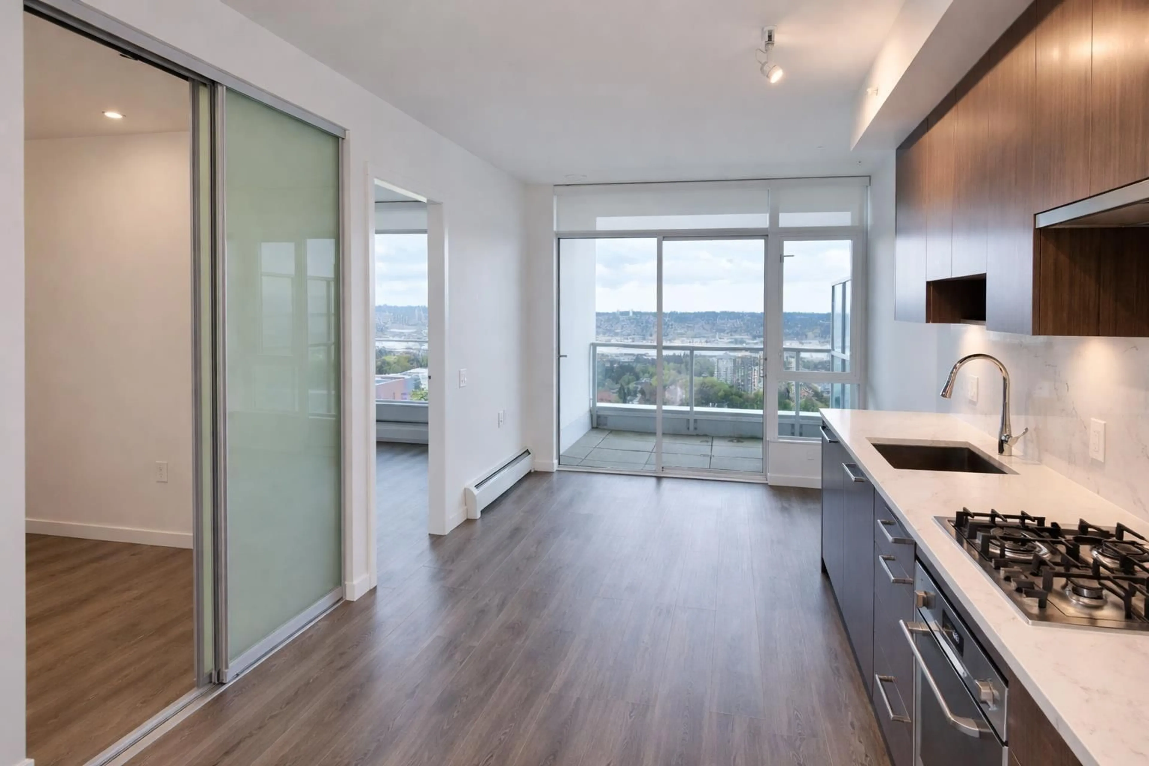 Open concept kitchen, wood/laminate floor for 3503 - 13350 CENTRAL AVENUE, Surrey British Columbia V3T0S1