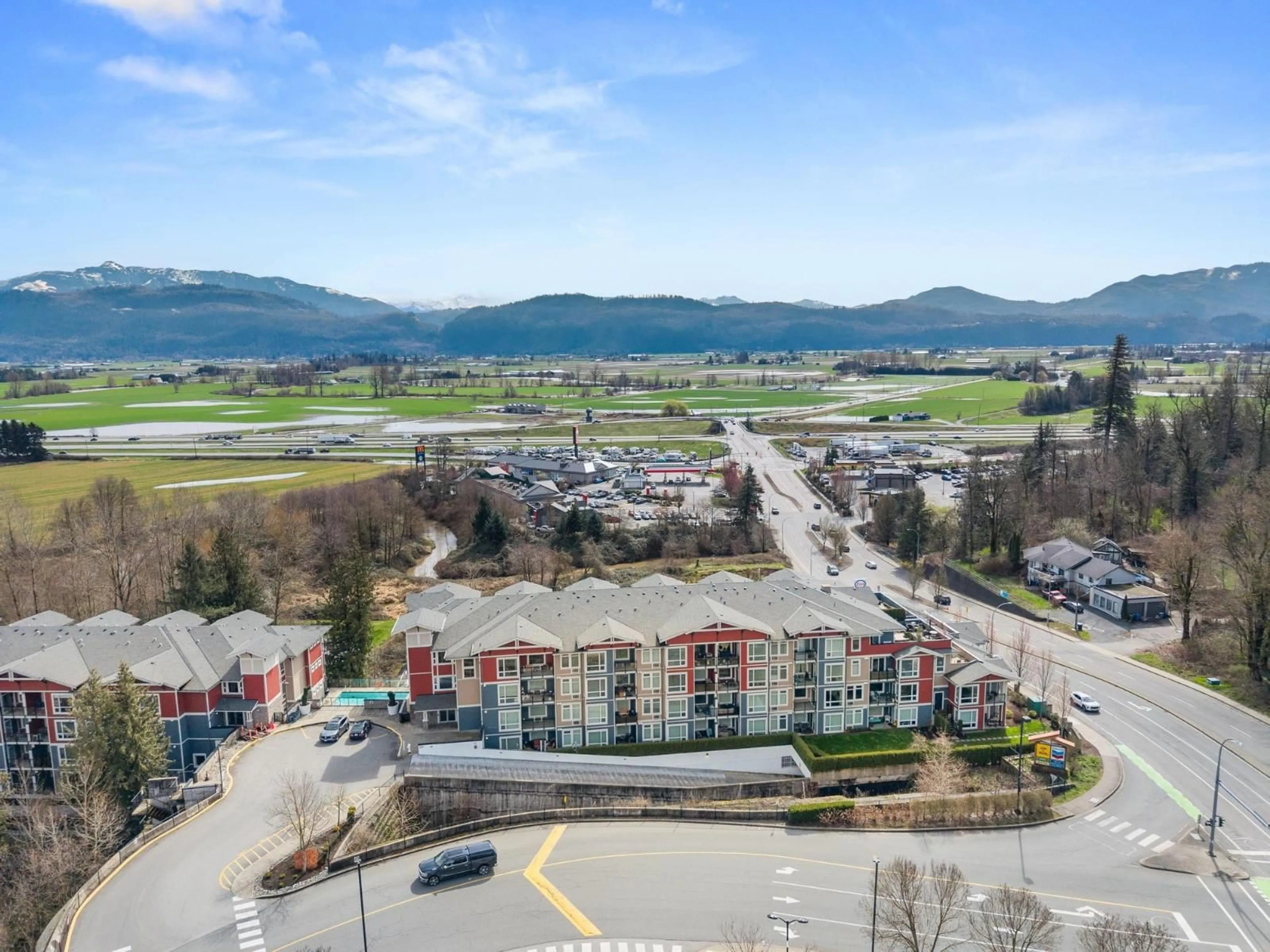 A pic from outside/outdoor area/front of a property/back of a property/a pic from drone, mountain view for 217 - 2242 WHATCOM ROAD, Abbotsford British Columbia V3G0G3
