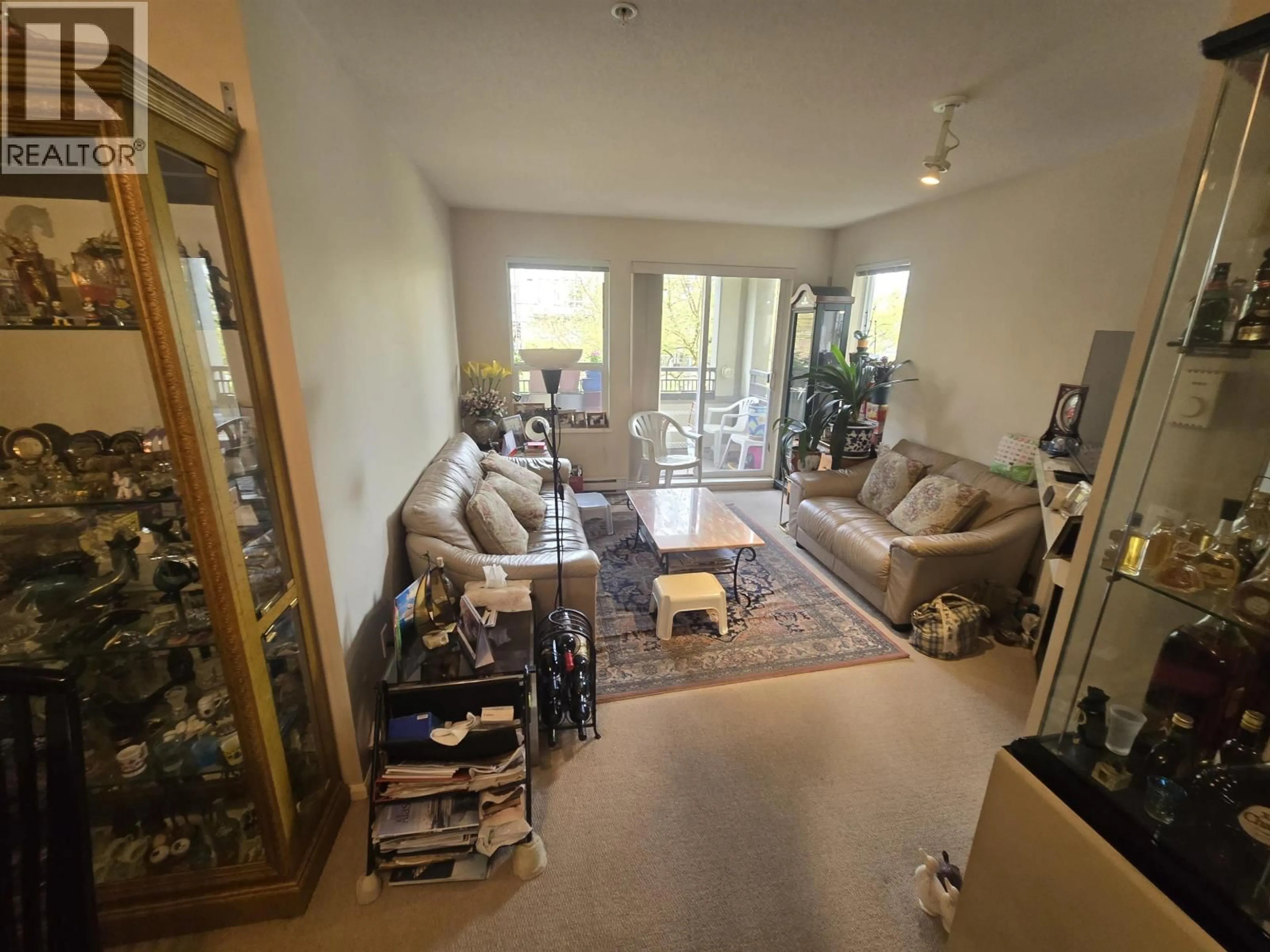 Living room with furniture, floor is not visible for 203 - 9200 FERNDALE ROAD, Richmond British Columbia V6Y4L2
