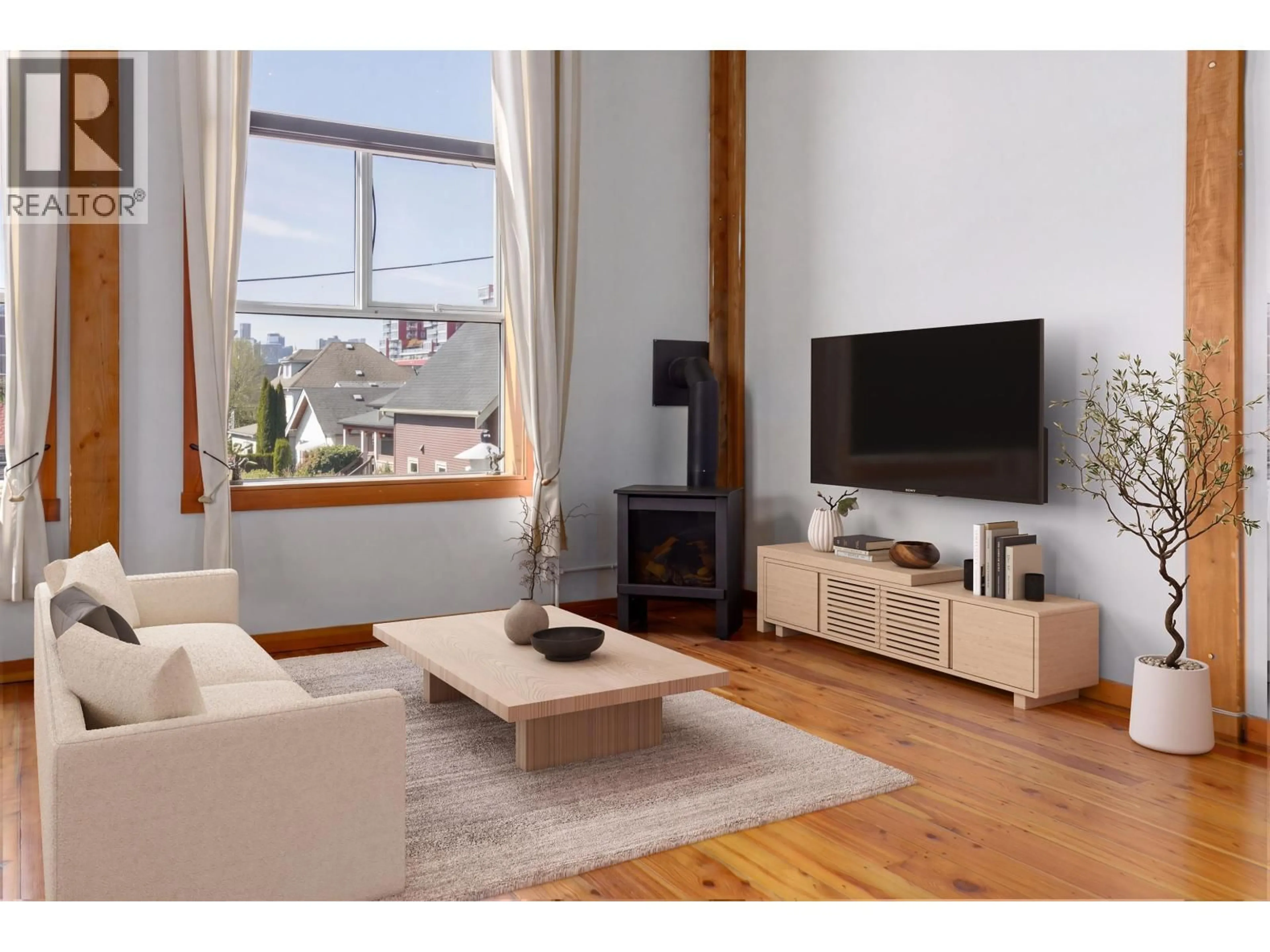 Living room with furniture, wood/laminate floor for 211 - 1220 PENDER STREET, Vancouver British Columbia V6A1W8