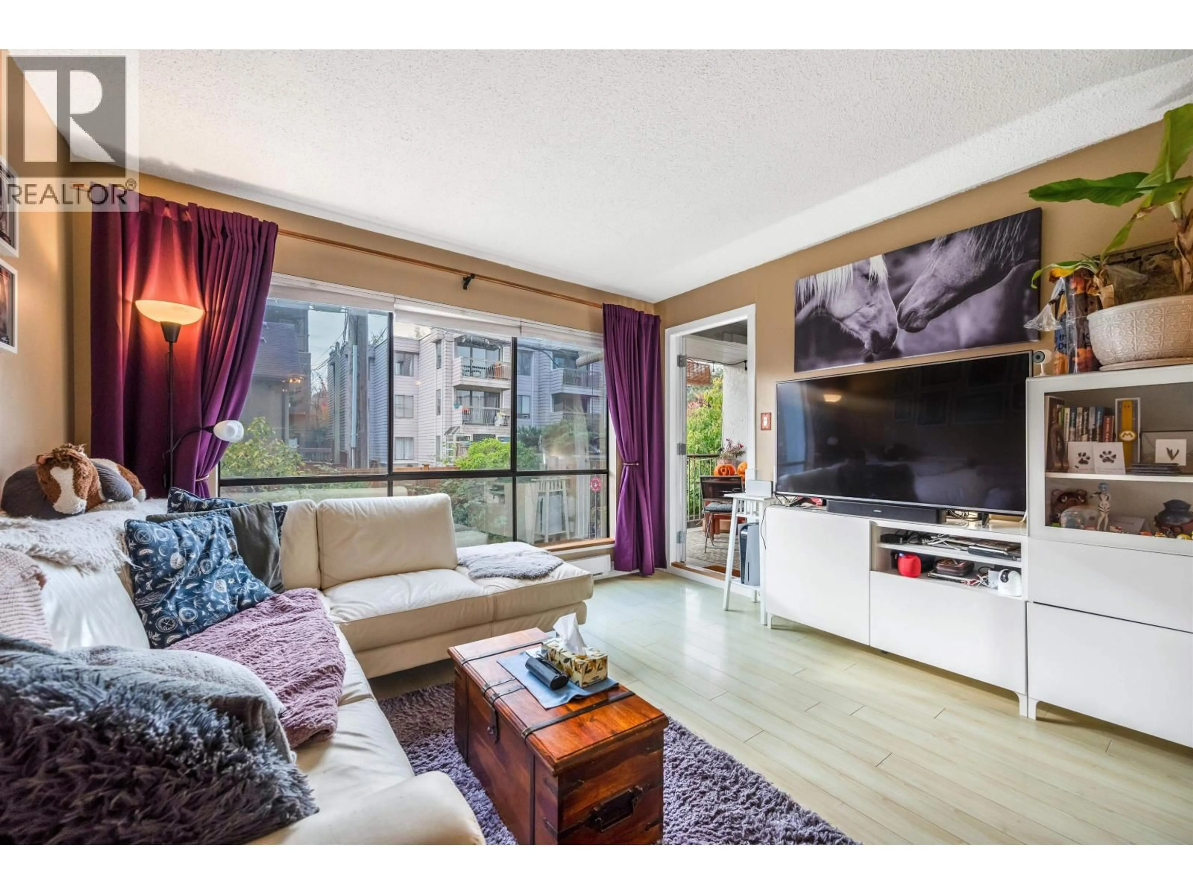 Living room with furniture, wood/laminate floor for 208 - 808 8 AVENUE, Vancouver British Columbia V5T1T5