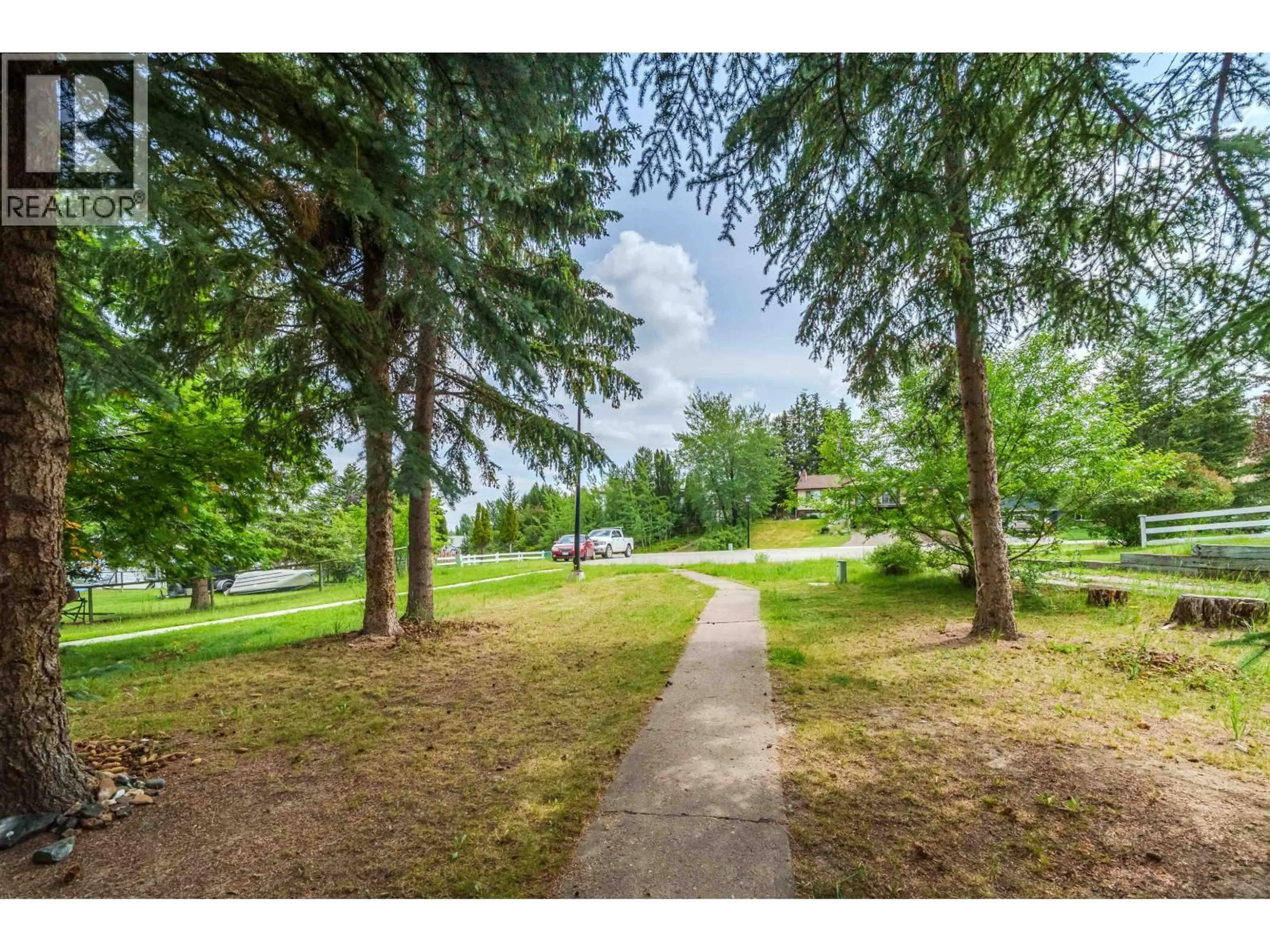 A pic from outside/outdoor area/front of a property/back of a property/a pic from drone, forest/trees view for 720 CARIBOO TRAIL, 100 Mile House British Columbia V0K2E0