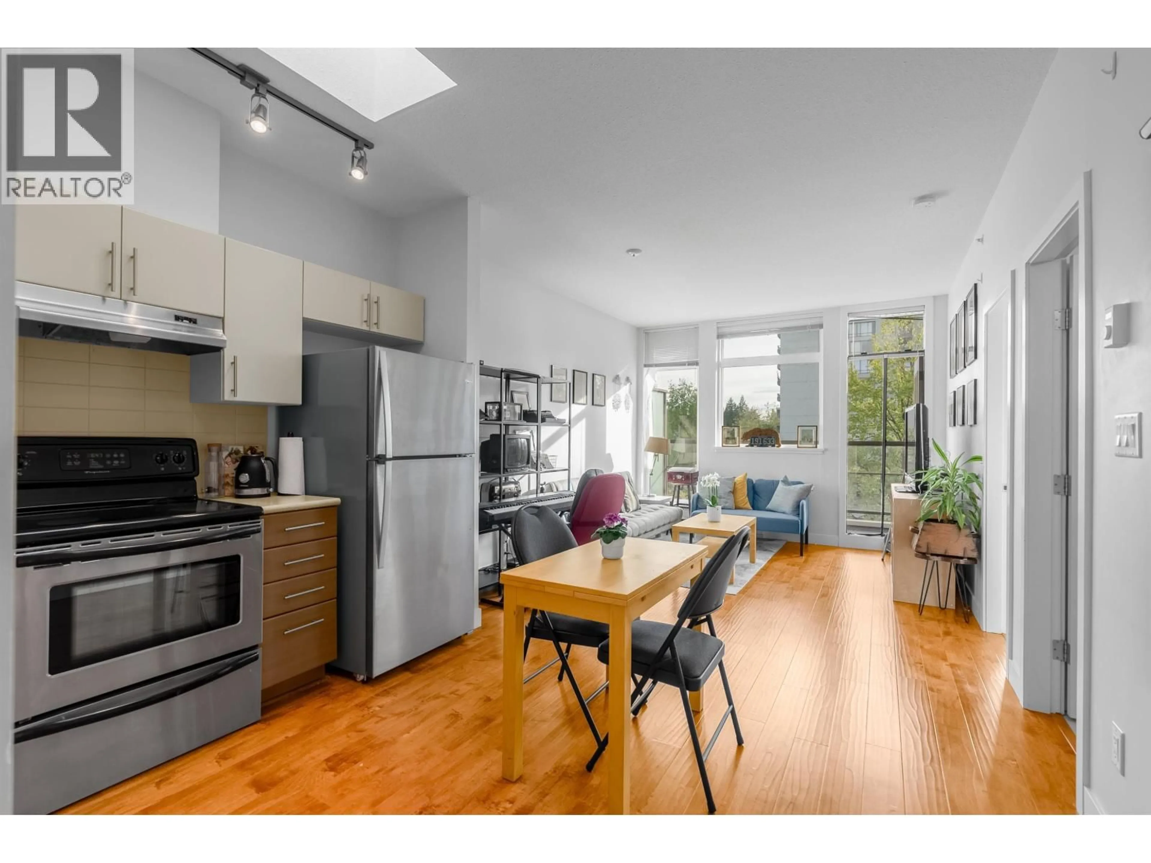 Open concept kitchen, wood/laminate floor for 409 - 5692 KINGS ROAD, Vancouver British Columbia V6T1K8