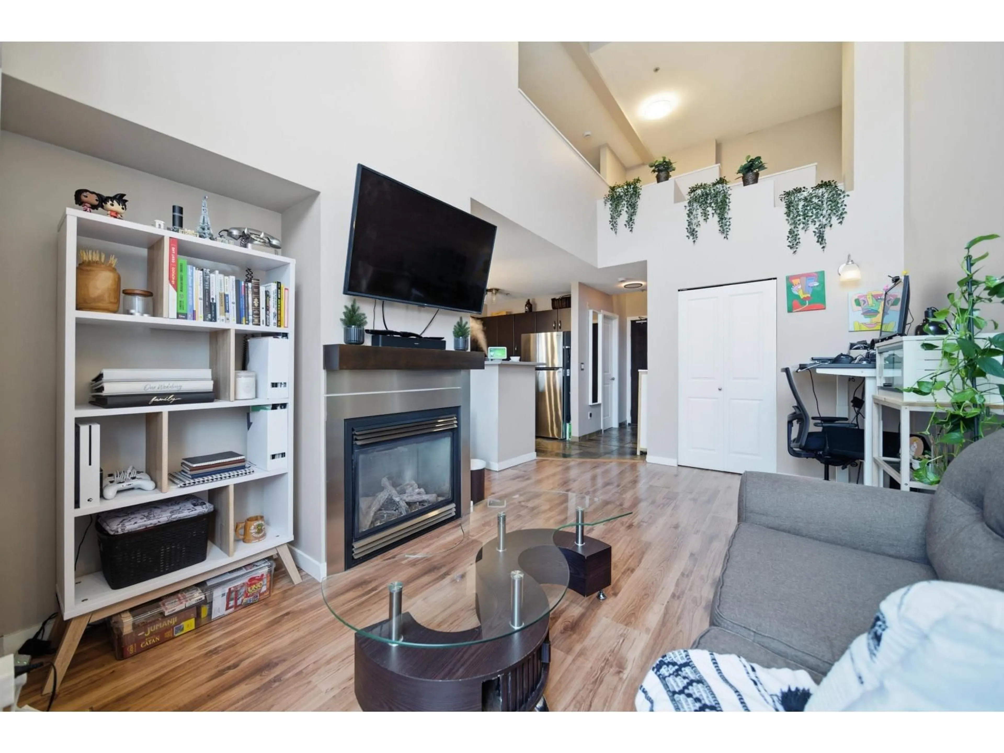 Living room with furniture, wood/laminate floor for 416 - 10866 CITY PARKWAY, Surrey British Columbia V3T5W9