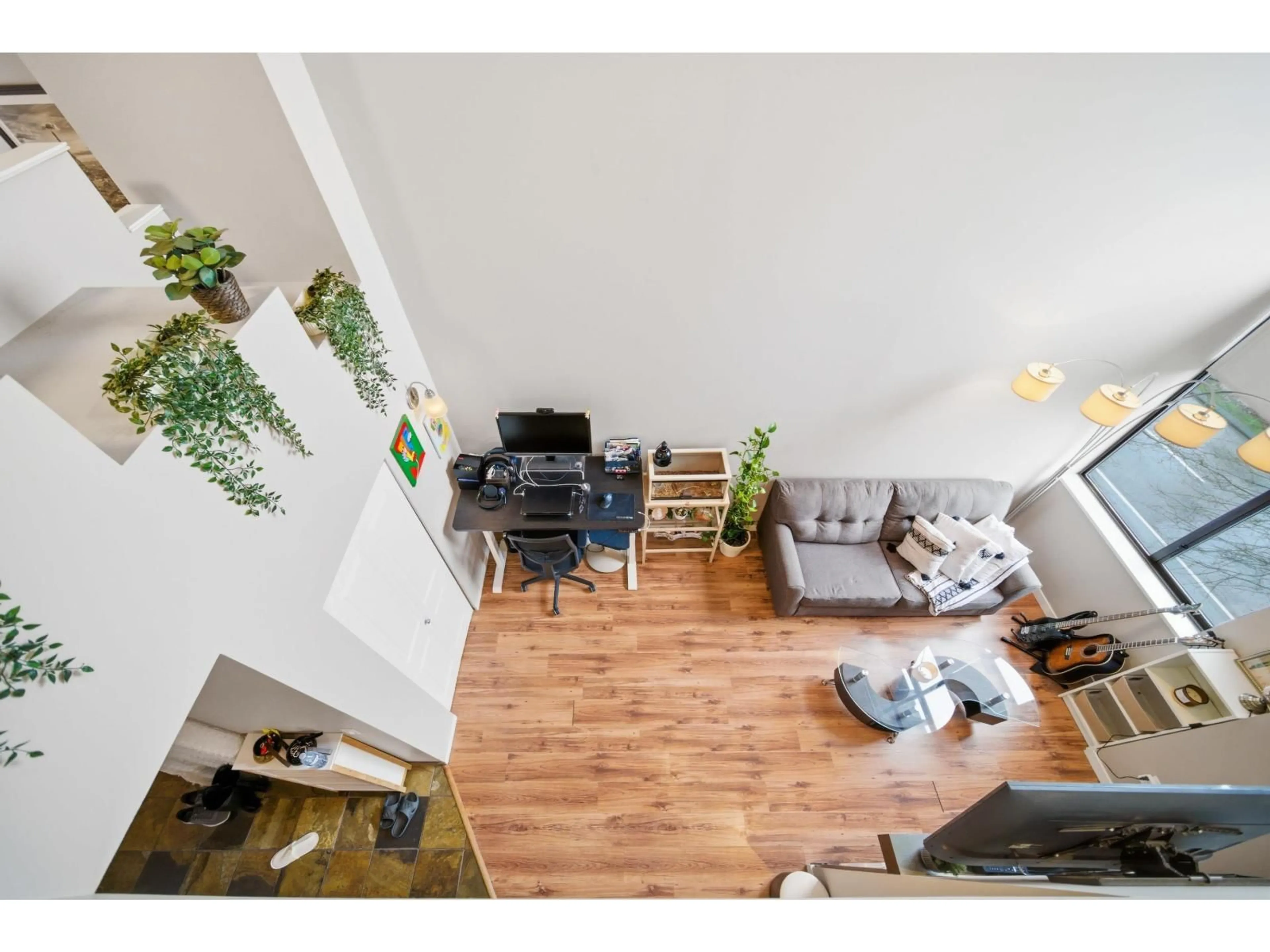 Living room with furniture, wood/laminate floor for 416 - 10866 CITY PARKWAY, Surrey British Columbia V3T5W9