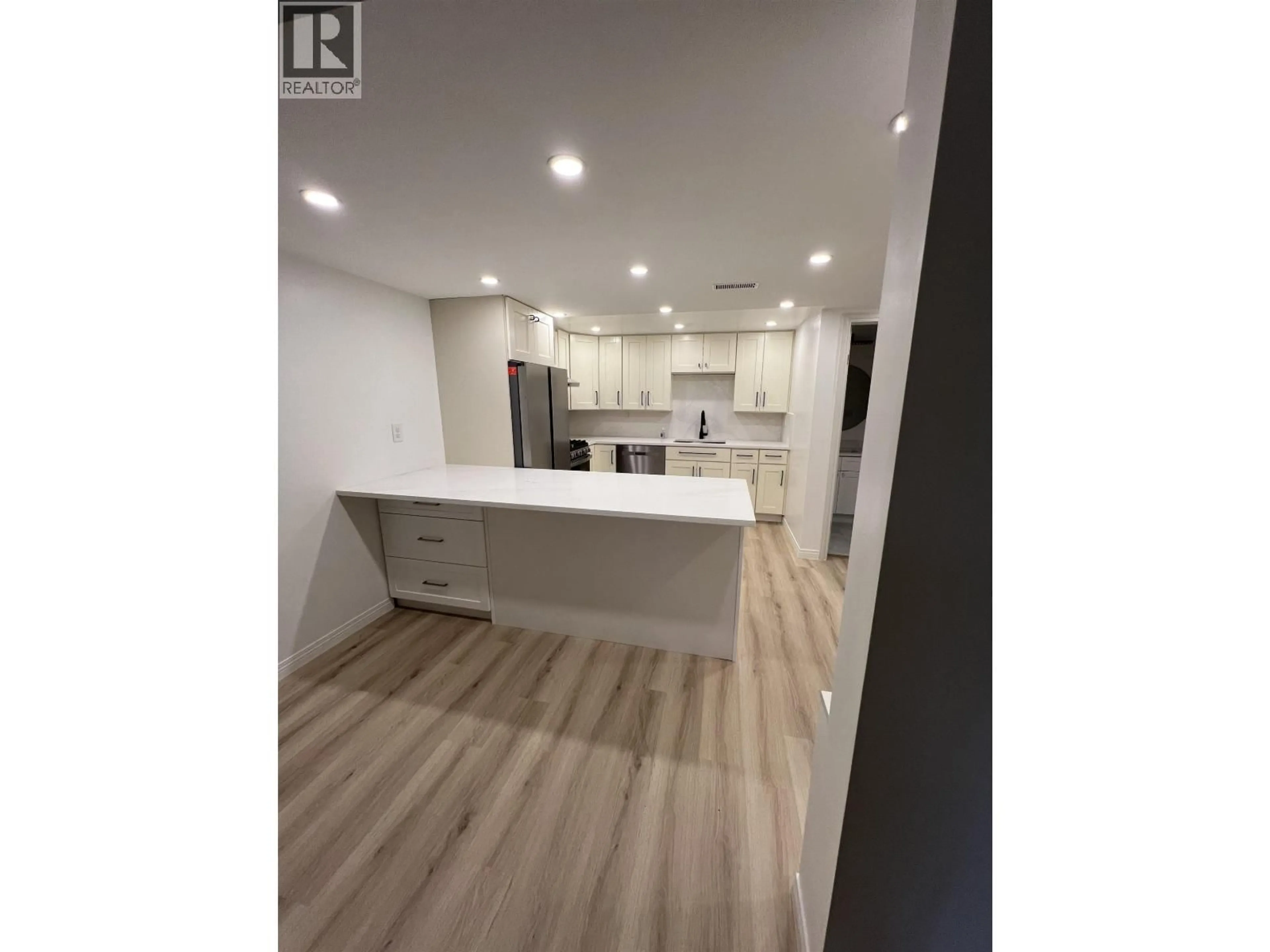 Open concept kitchen, wood/laminate floor for 2556 TRILLIUM PLACE, Coquitlam British Columbia V3E2G3