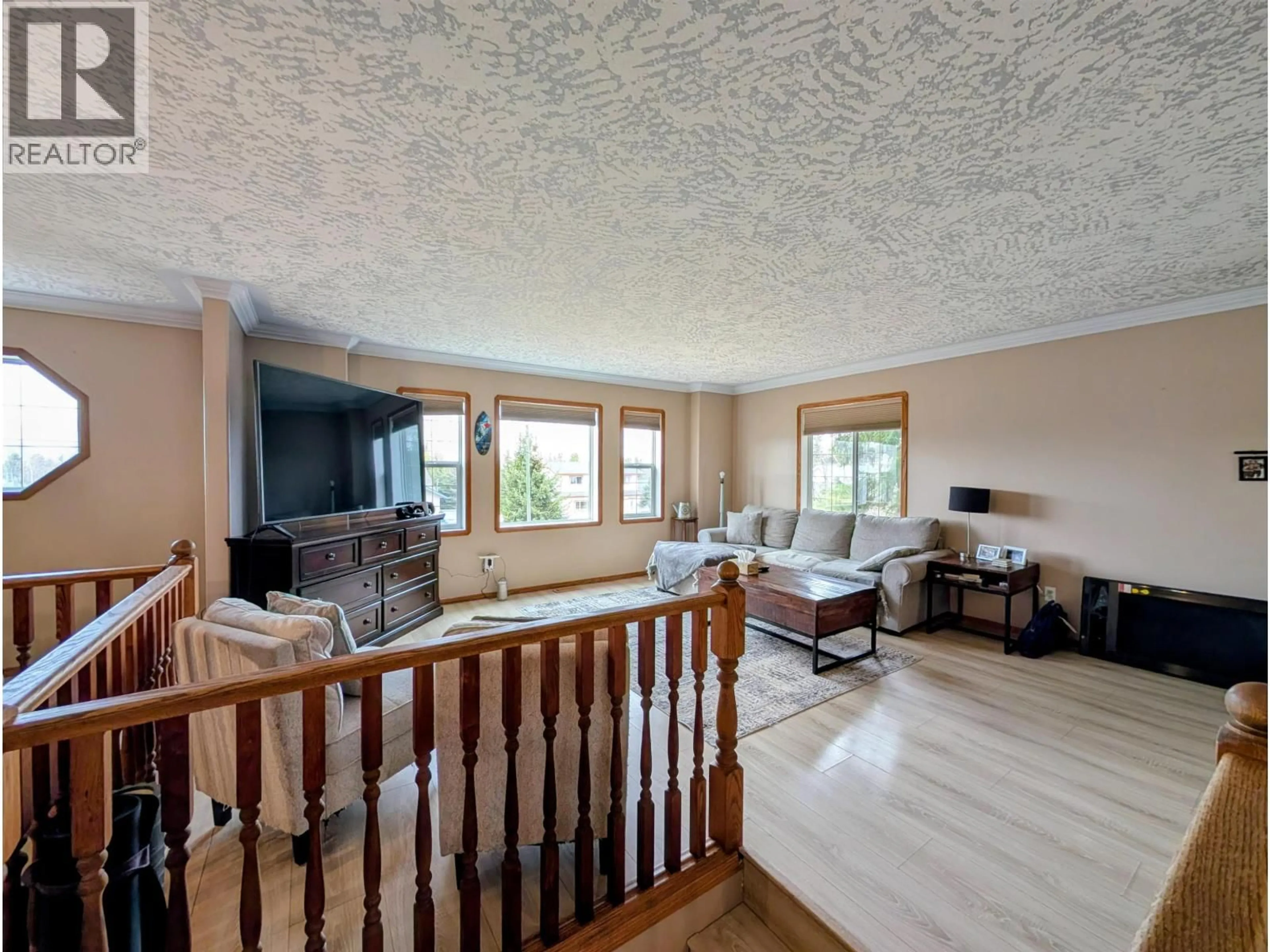 Living room with furniture, wood/laminate floor for 1475 CHESTNUT STREET, Telkwa British Columbia V0J2X0