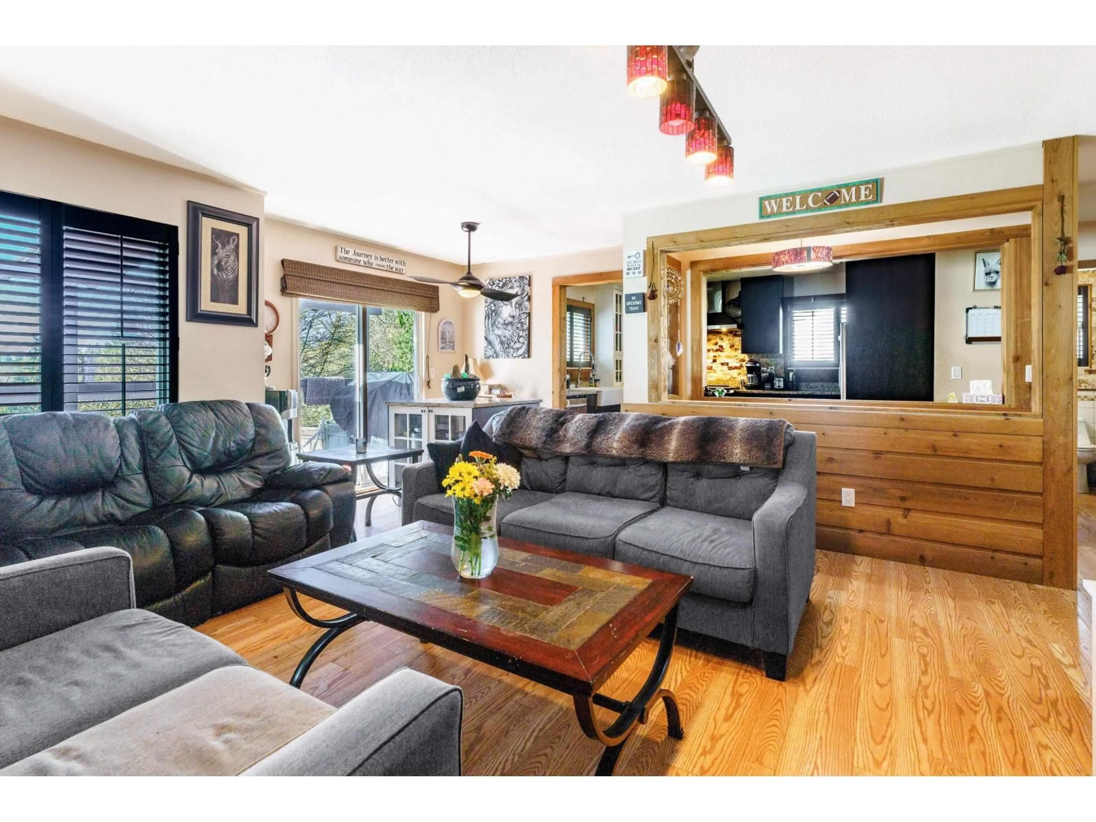 Living room with furniture, wood/laminate floor for 7655 WOODCOCK CRESCENT, Mission British Columbia V2V4J8