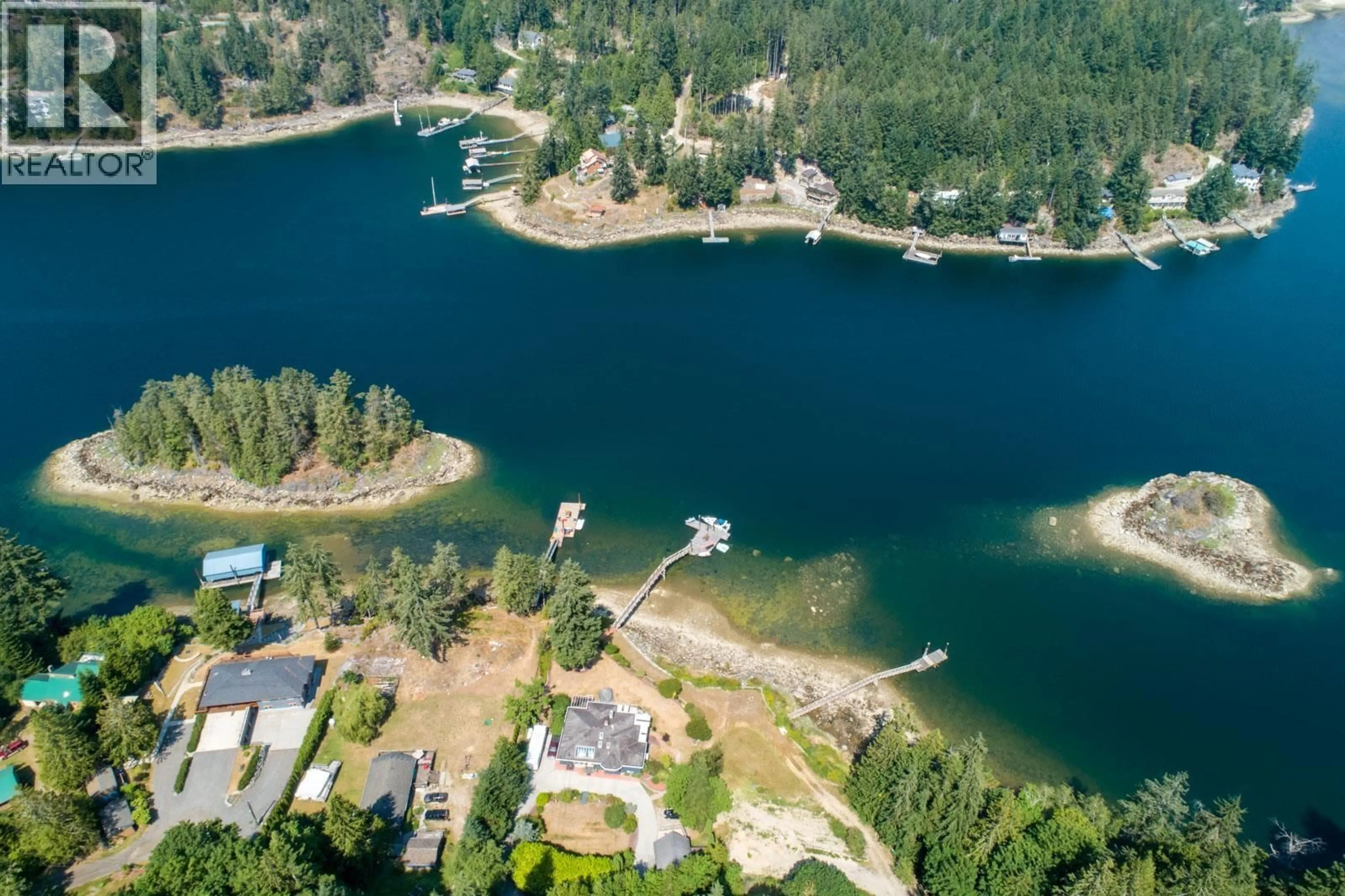 A pic from outside/outdoor area/front of a property/back of a property/a pic from drone, water/lake/river/ocean view for 12881 SUNSHINE COAST HIGHWAY, Madeira Park British Columbia V0N2H1