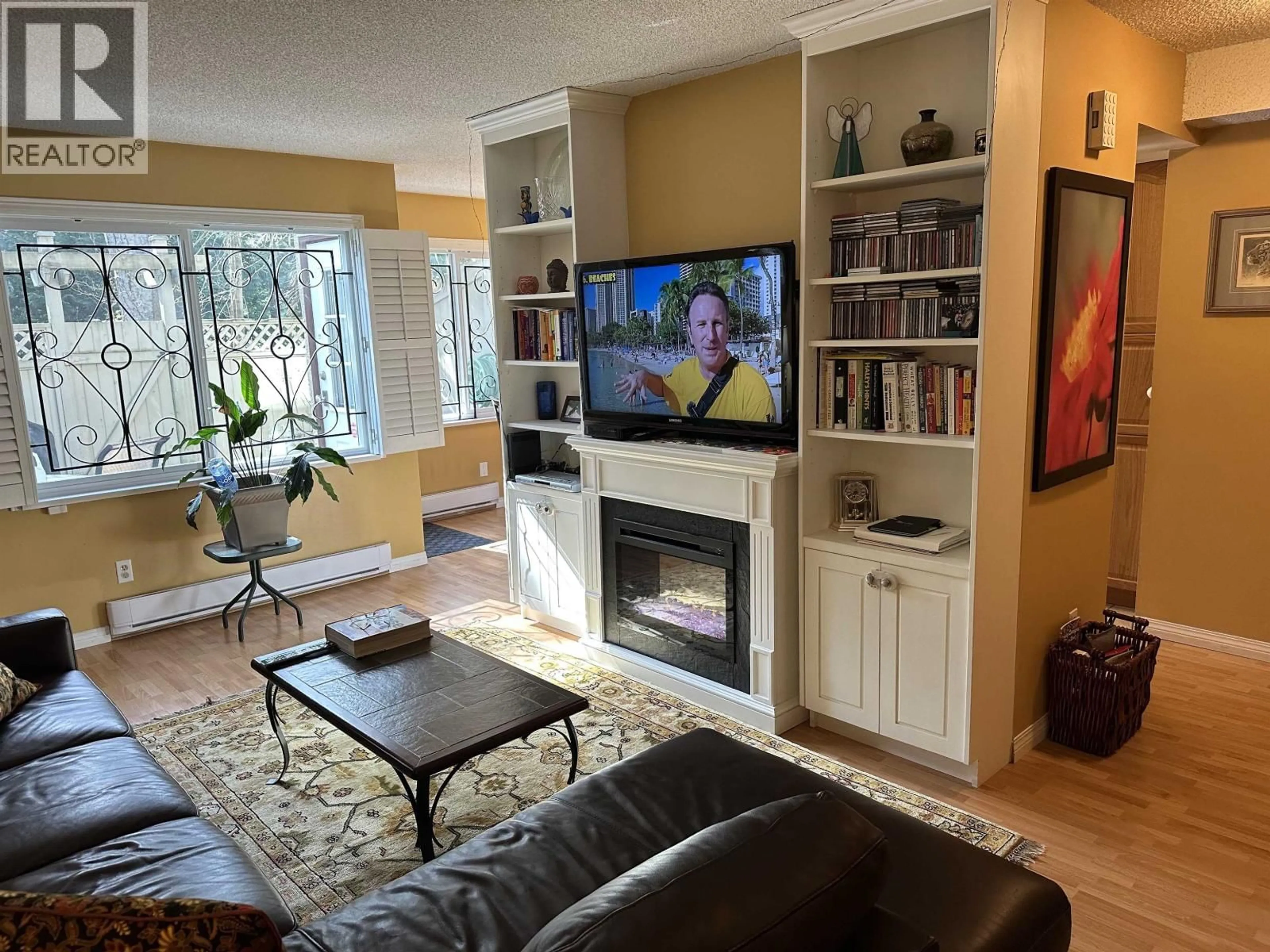 Living room with furniture, wood/laminate floor for 3444 LANGFORD AVENUE, Vancouver British Columbia V5S4B7