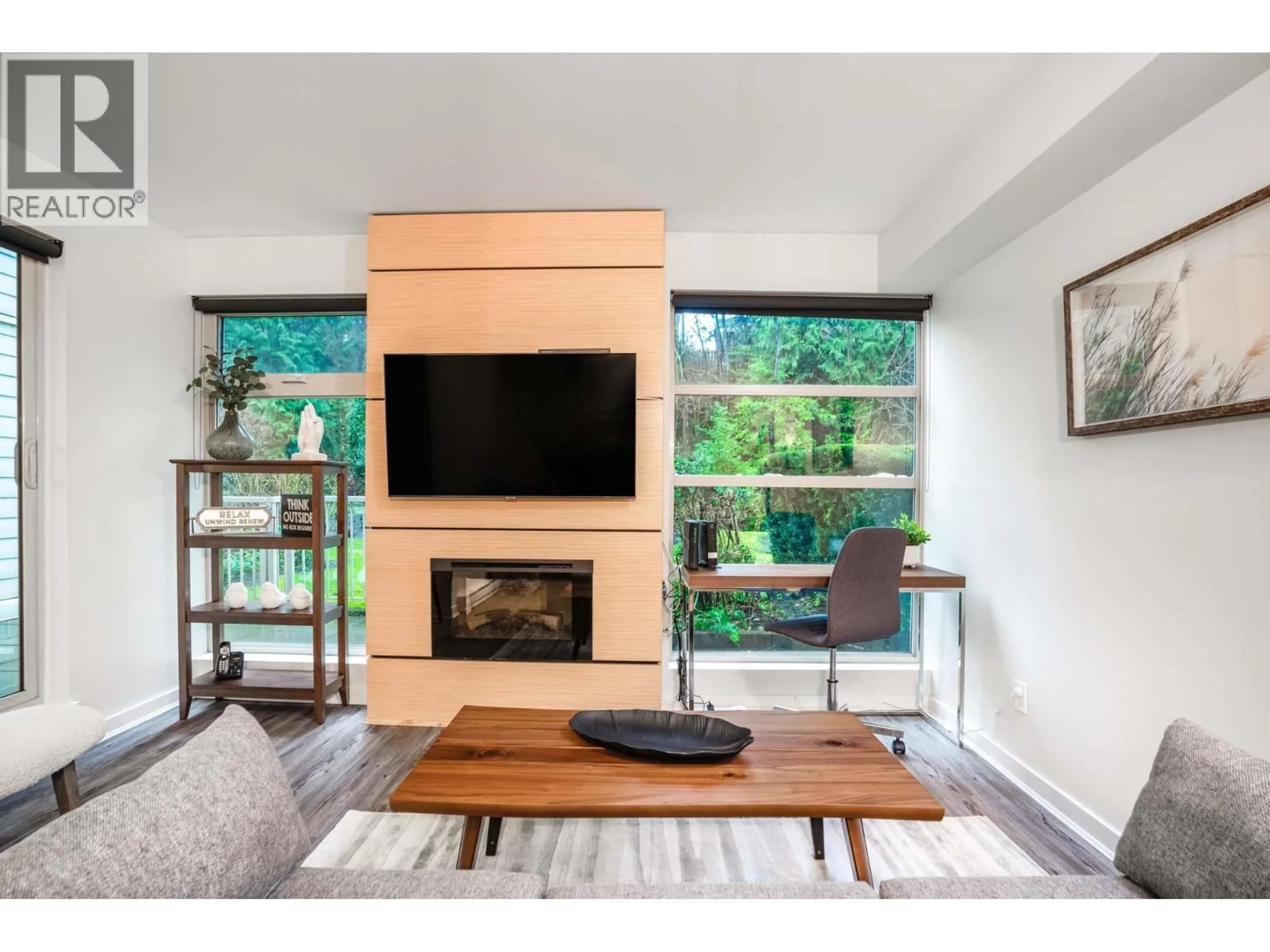 Living room with furniture, wood/laminate floor for 104 - 2832 CAPILANO ROAD, North Vancouver British Columbia V7R4H5