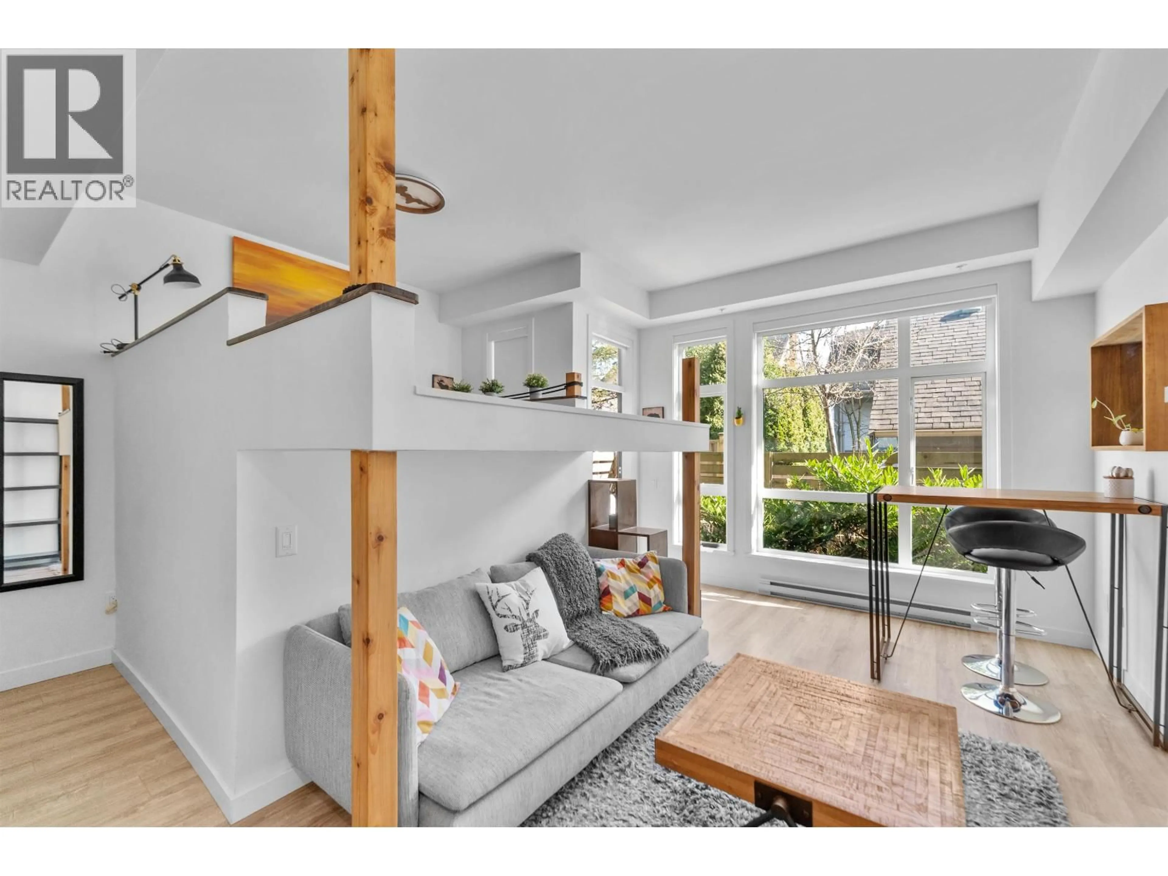 Living room with furniture, wood/laminate floor for 104 - 610 BRANTFORD STREET, New Westminster British Columbia V3M1W7