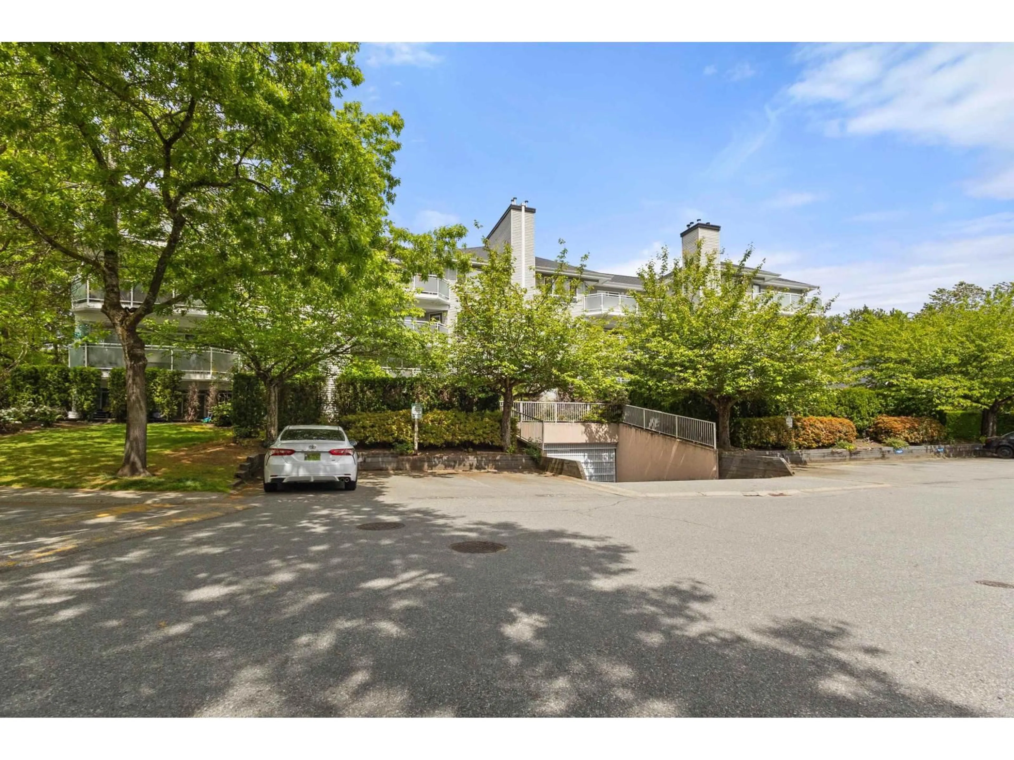 A pic from outside/outdoor area/front of a property/back of a property/a pic from drone, street for 405 - 13680 84 AVENUE, Surrey British Columbia V3W0T6