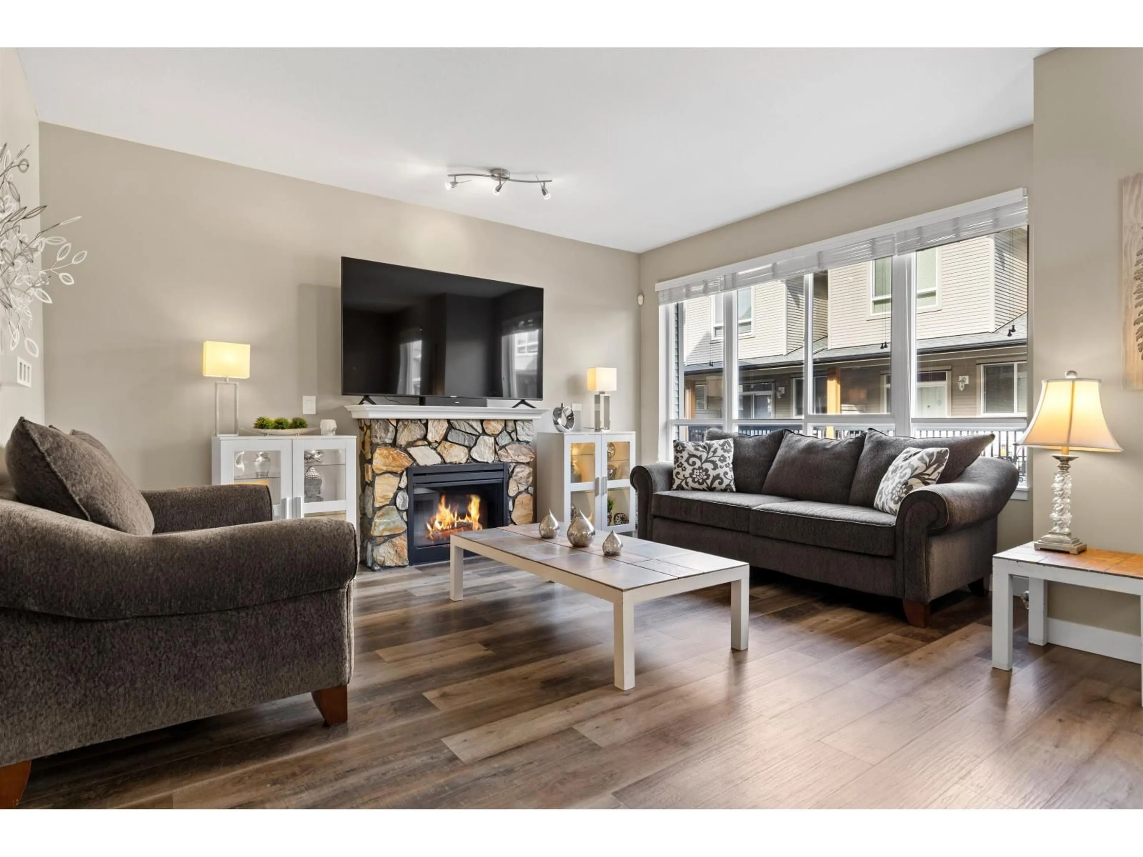 Living room with furniture, wood/laminate floor for 12 - 16772 61 AVENUE, Surrey British Columbia V3S4P2