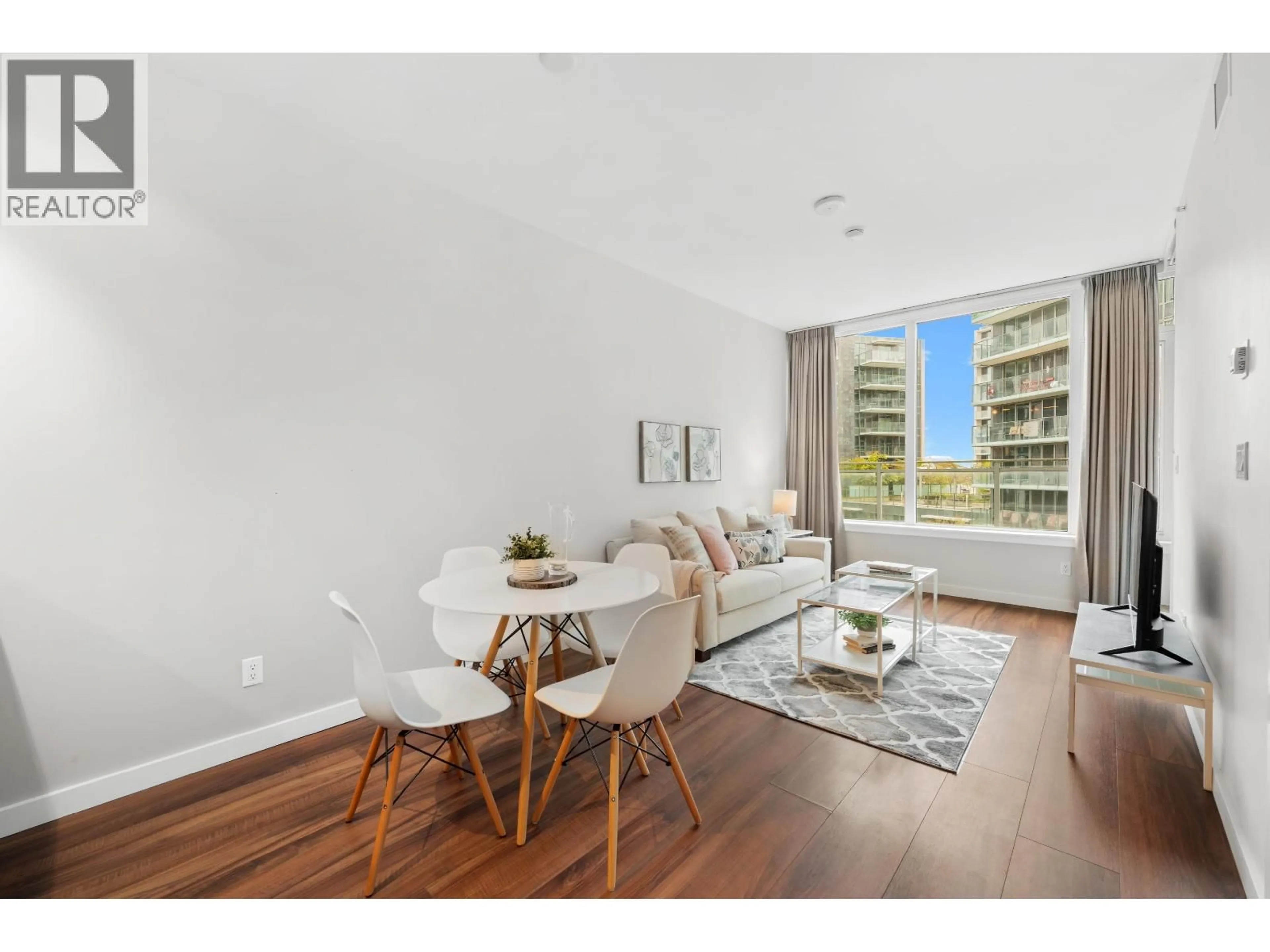 Living room with furniture, wood/laminate floor for 808 - 8628 HAZELBRIDGE WAY, Richmond British Columbia V6X0R5