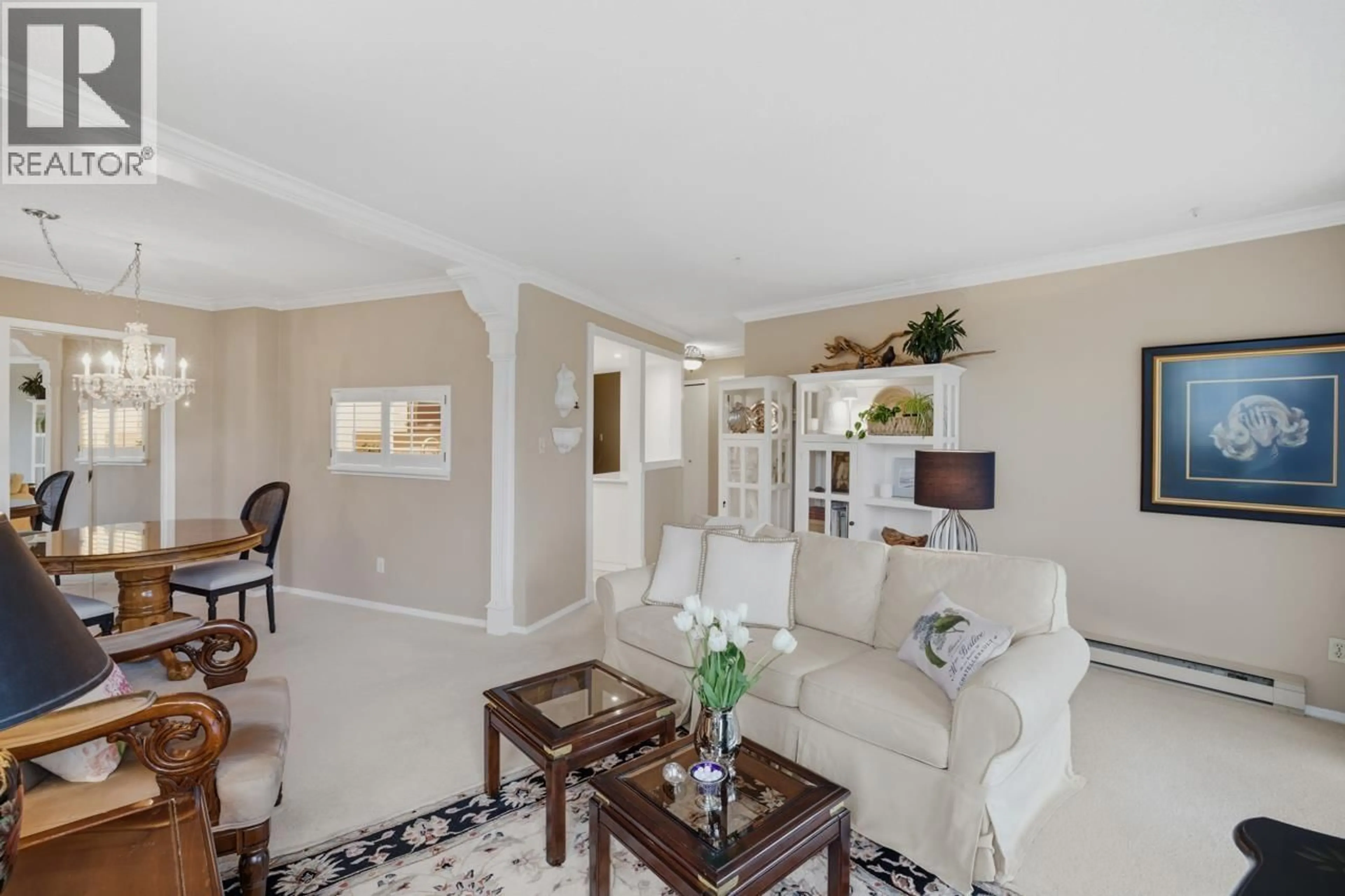 Living room with furniture, ceramic/tile floor for 704 - 995 ROCHE POINT DRIVE, North Vancouver British Columbia V7H2X4