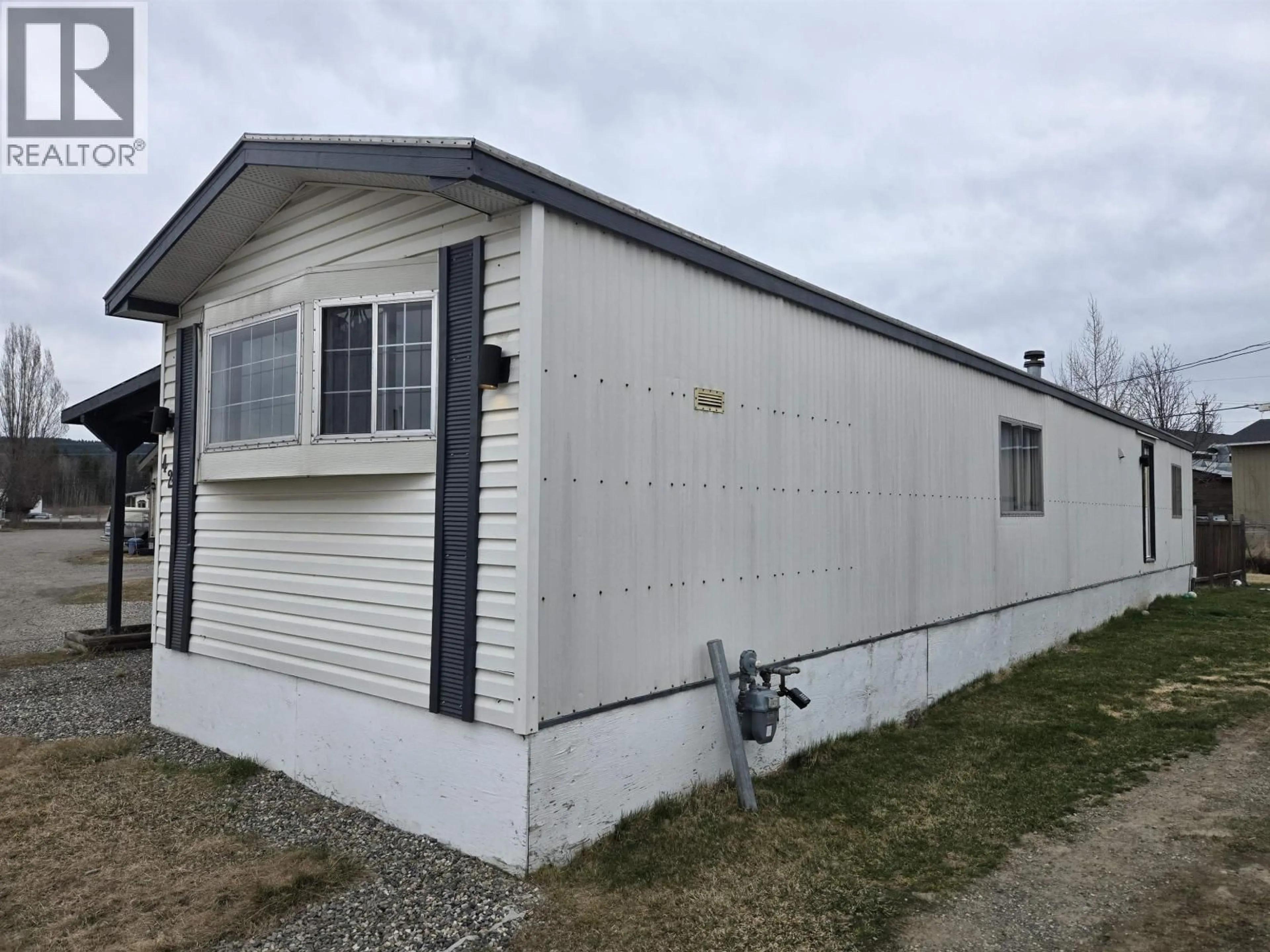 Home with vinyl exterior material, building for 42 - 634 ELM STREET, Quesnel British Columbia V2J3X1