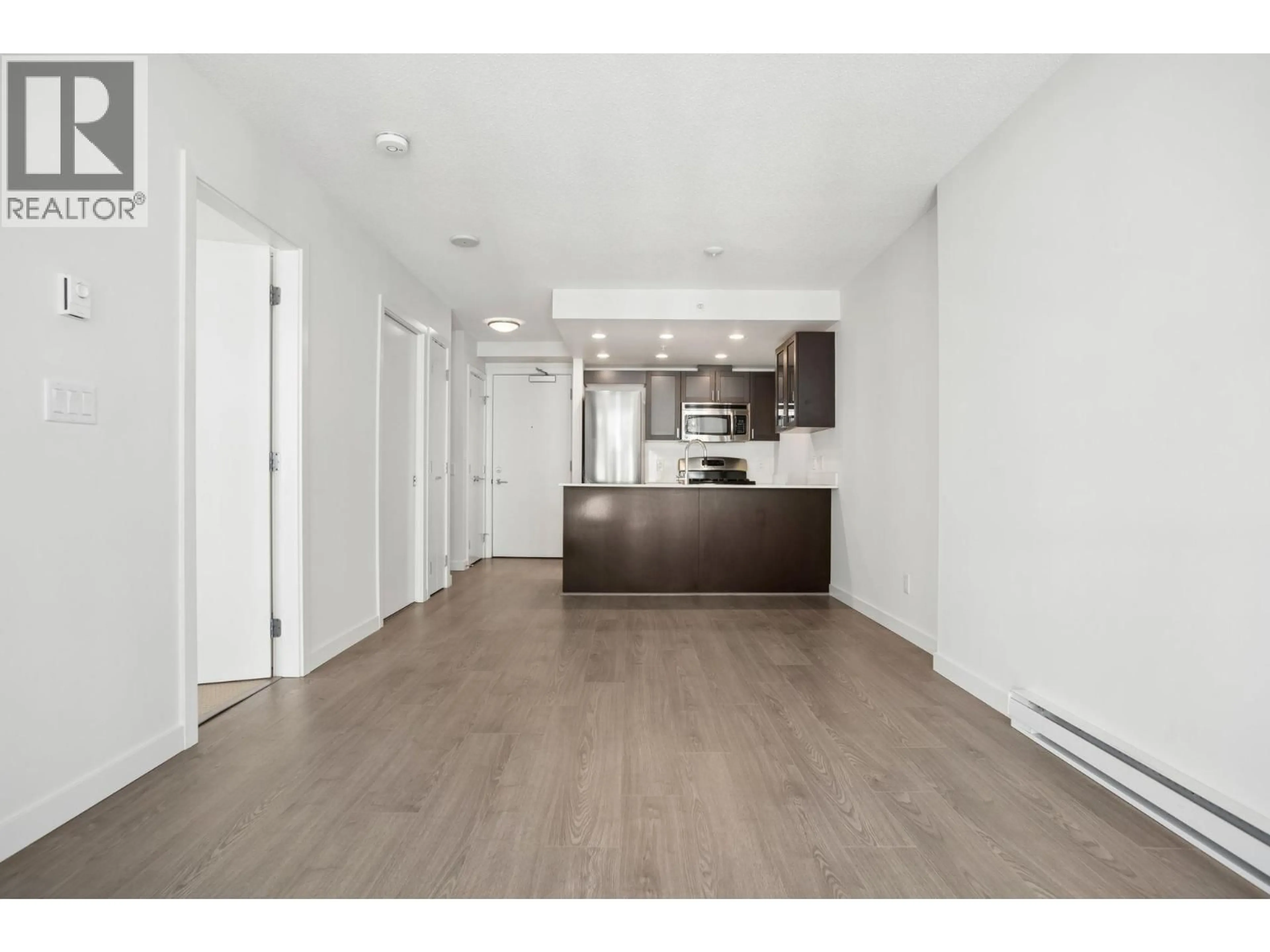 Open concept kitchen, wood/laminate floor for 206 - 4815 ELDORADO MEWS, Vancouver British Columbia V5R0B2