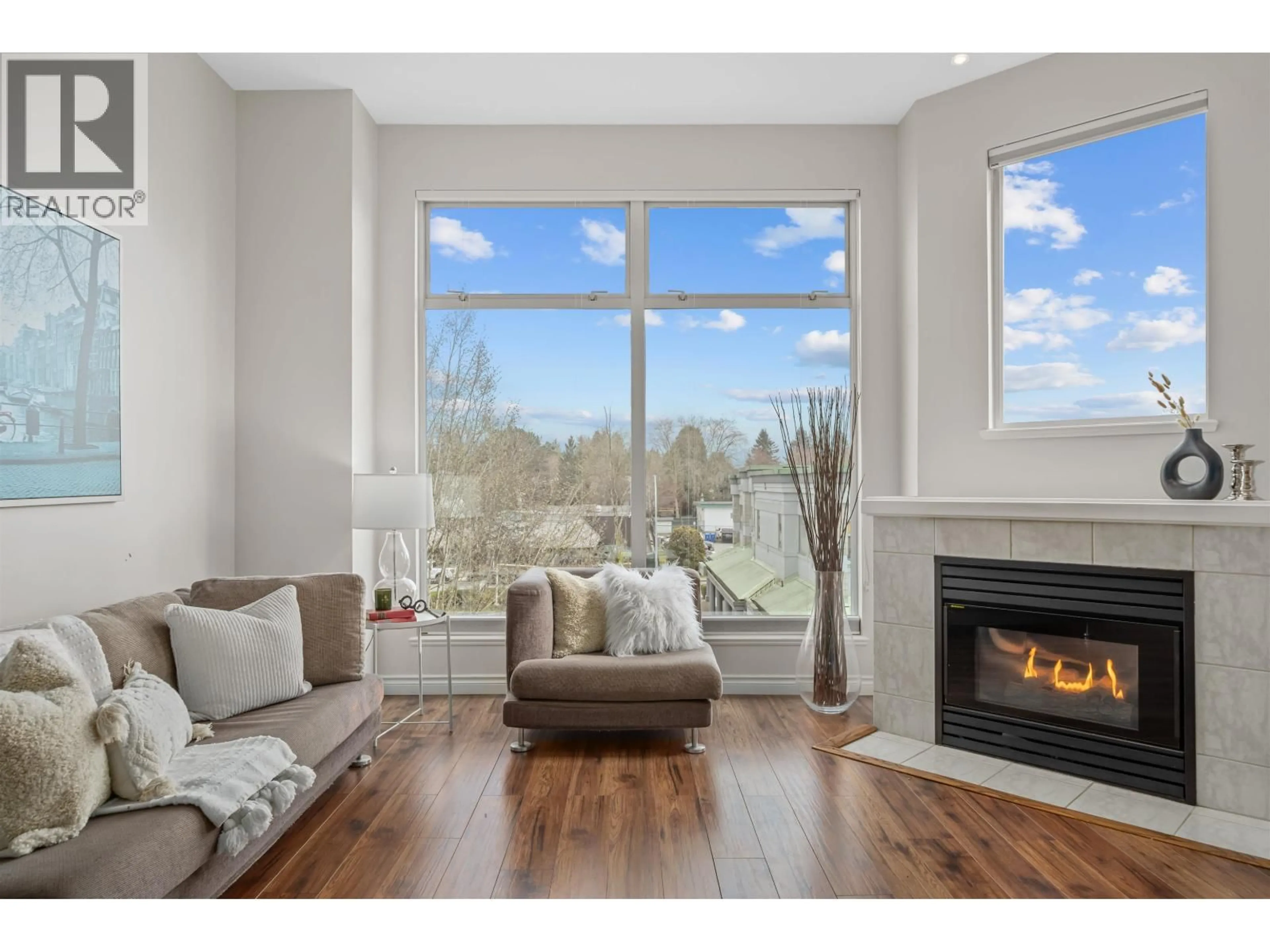 Living room with furniture, wood/laminate floor for 307 - 19131 FORD ROAD, Pitt Meadows British Columbia V3Y2R5