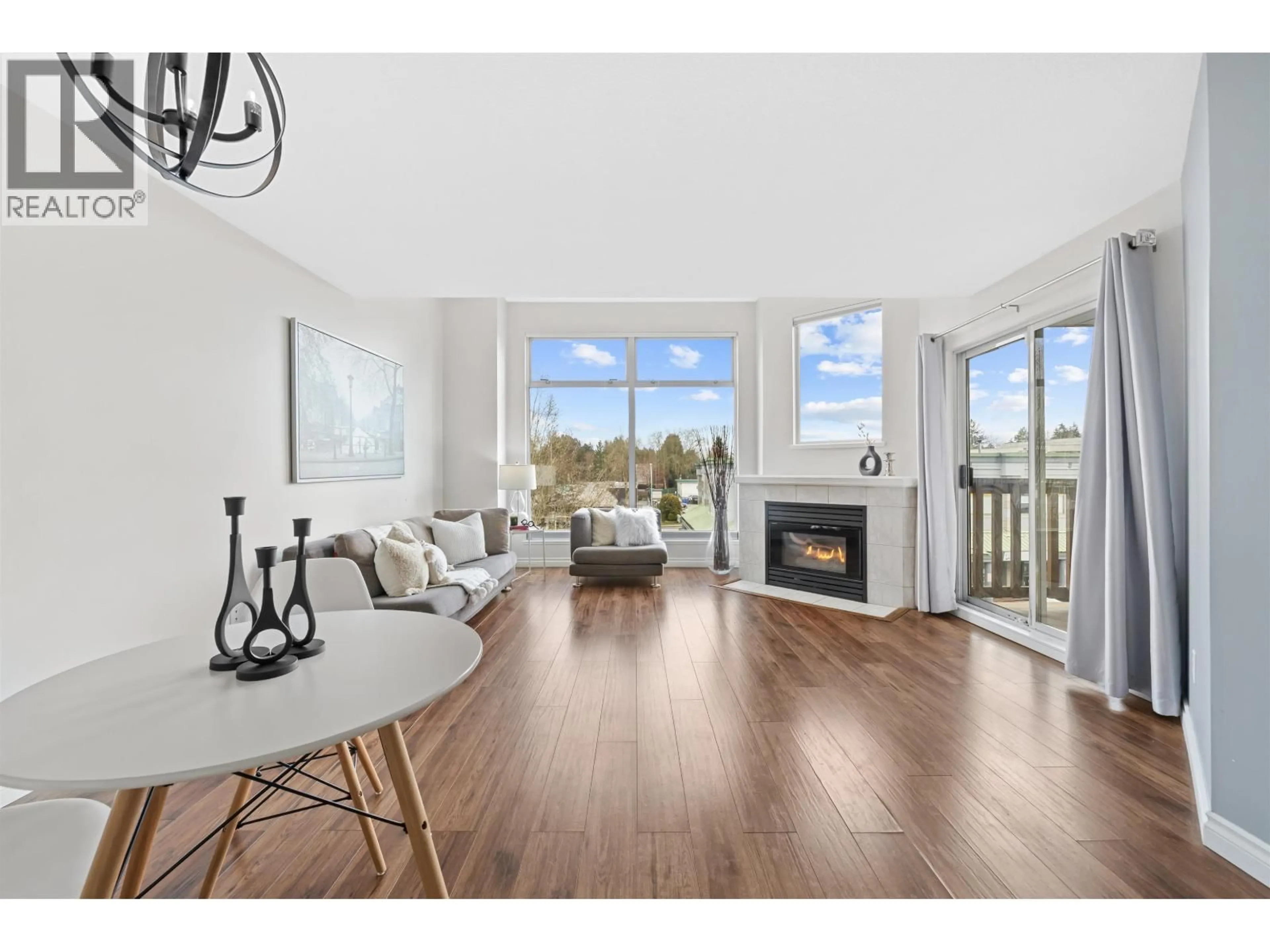 Living room with furniture, wood/laminate floor for 307 - 19131 FORD ROAD, Pitt Meadows British Columbia V3Y2R5