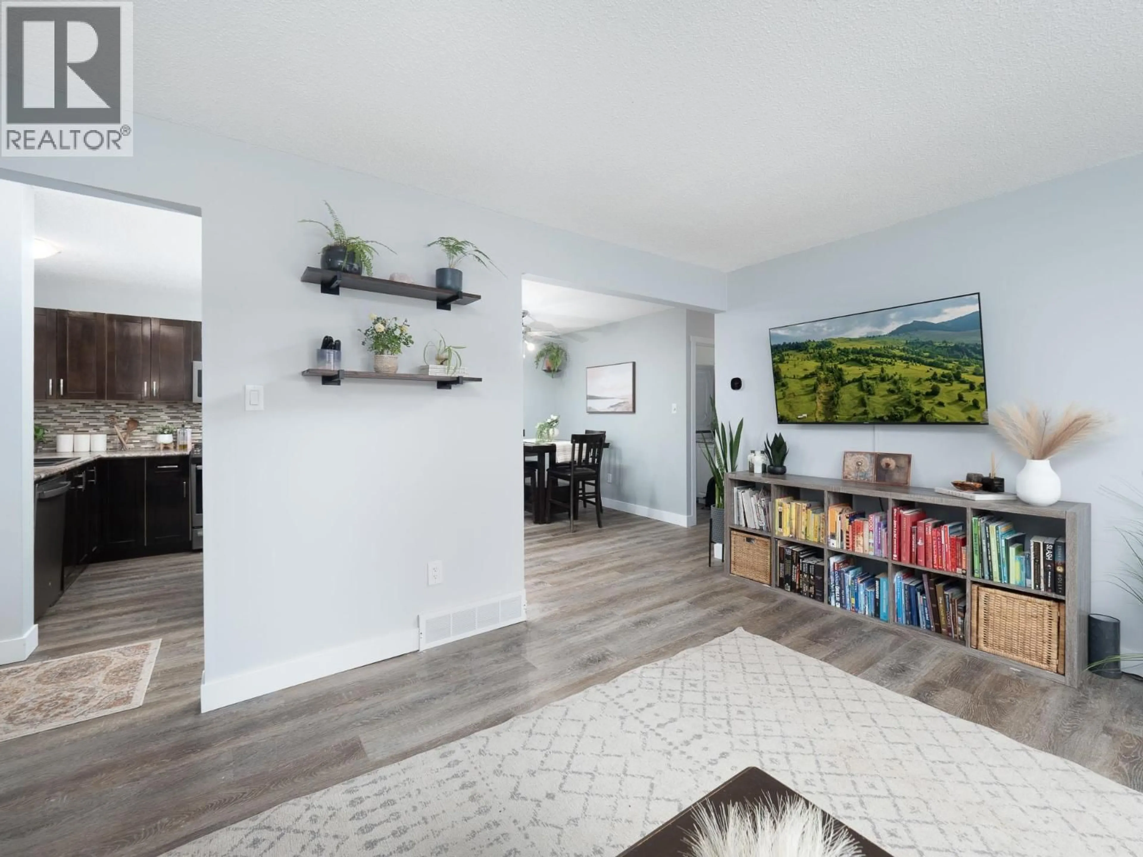 Living room with furniture, wood/laminate floor for 2293 TAPPING STREET, Prince George British Columbia V2N3B5